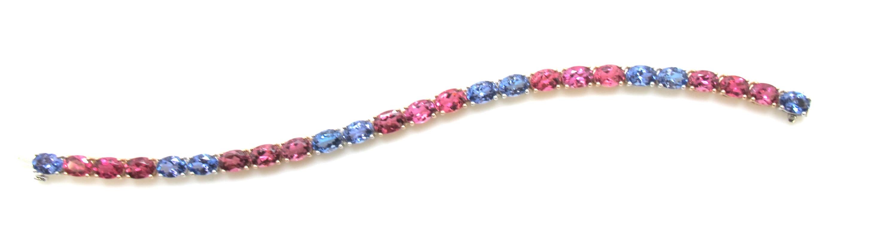 Oval Cut Tanzanite and Pink Tourmaline Tennis Bracelet in White and Rose Gold For Sale