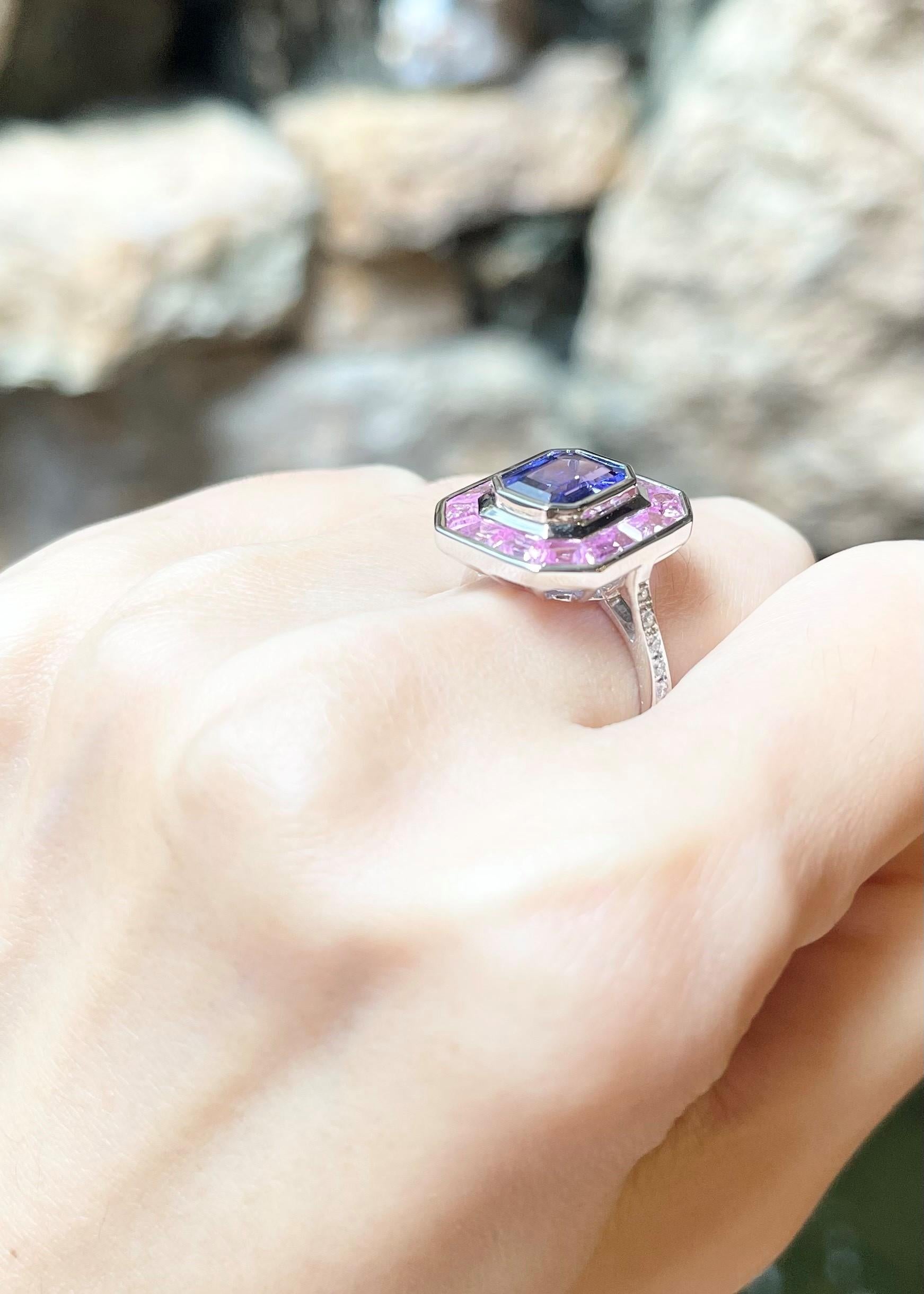 Tanzanite 2.17 carats, Pink Sapphire 2.35 carats and Diamond 0.14 carat Ring set in 18K White Gold Settings

Width:  1.5 cm 
Length: 1.7 cm
Ring Size: 53
Total Weight: 7.69 grams


