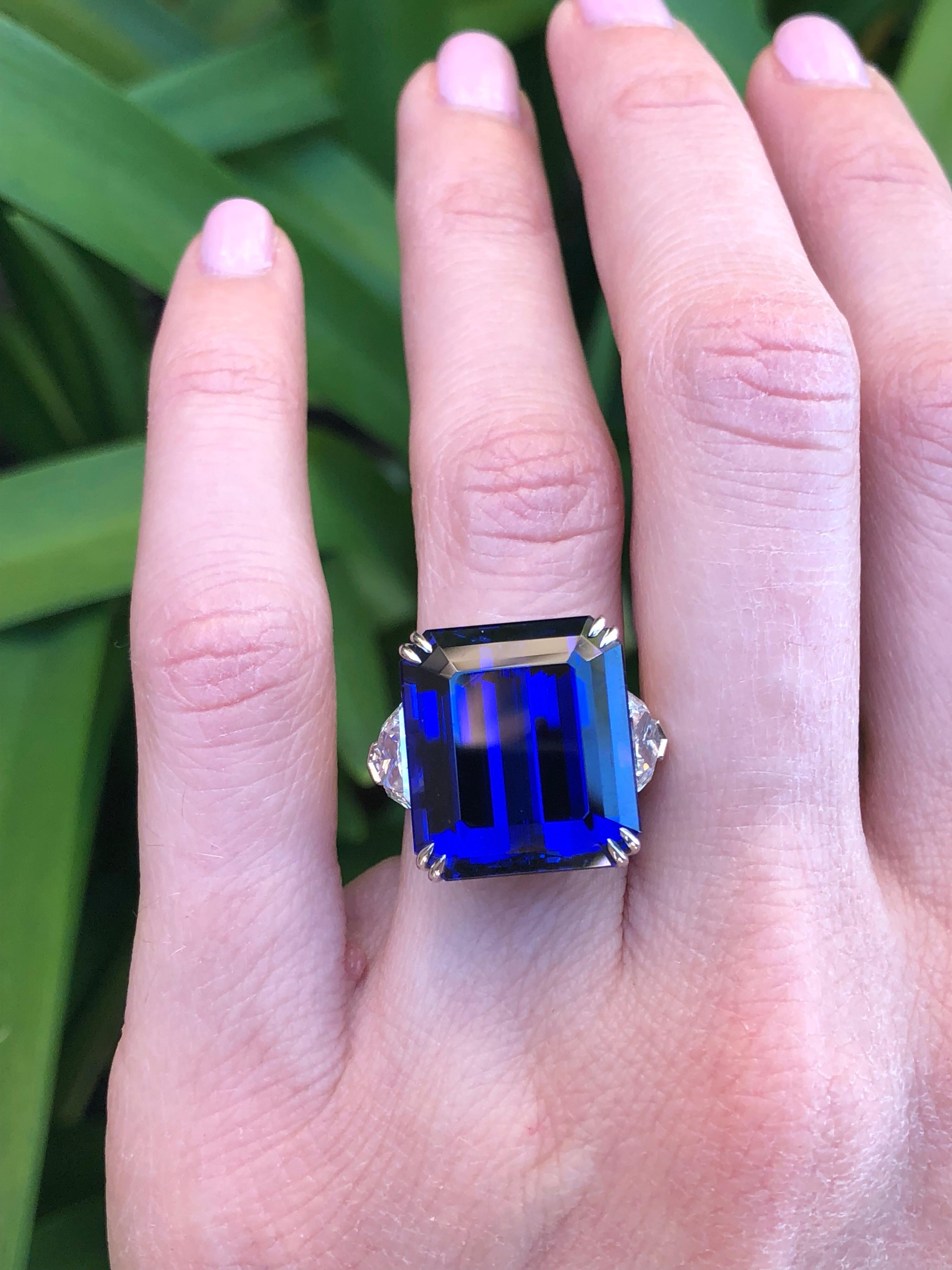 Exceptional 20.51 carat emerald-cut Tanzanite platinum ring, flanked by a pair of 2.04 carats total F/VS2 