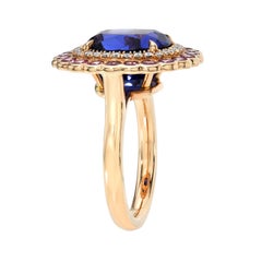6.59 Carat Tanzanite Cushion Cocktail Ring in 18K Rose Gold with Pink Sapphires
