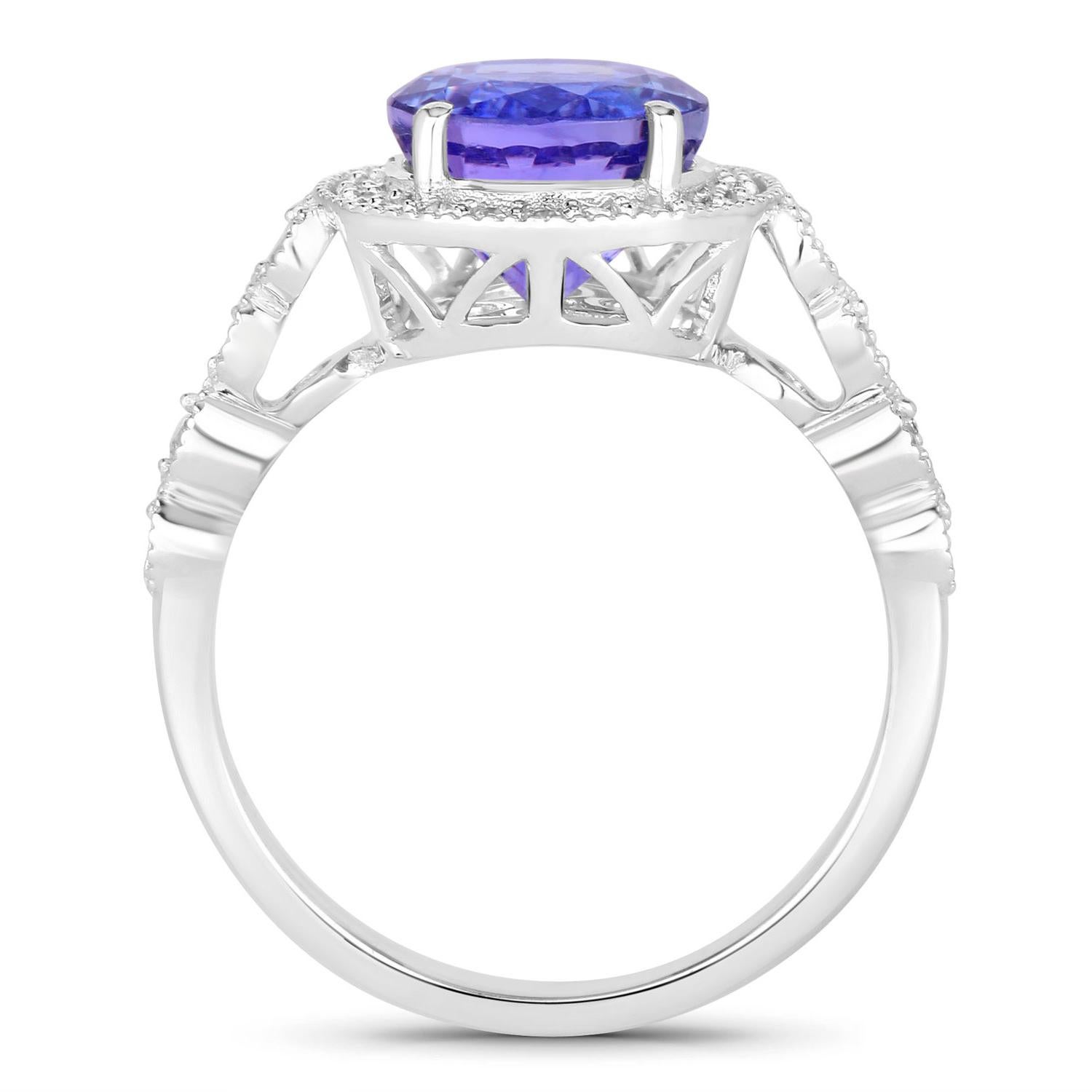 Taglio rotondo Anello di tanzanite con diamanti da 3,20 carati in oro bianco 14K in vendita