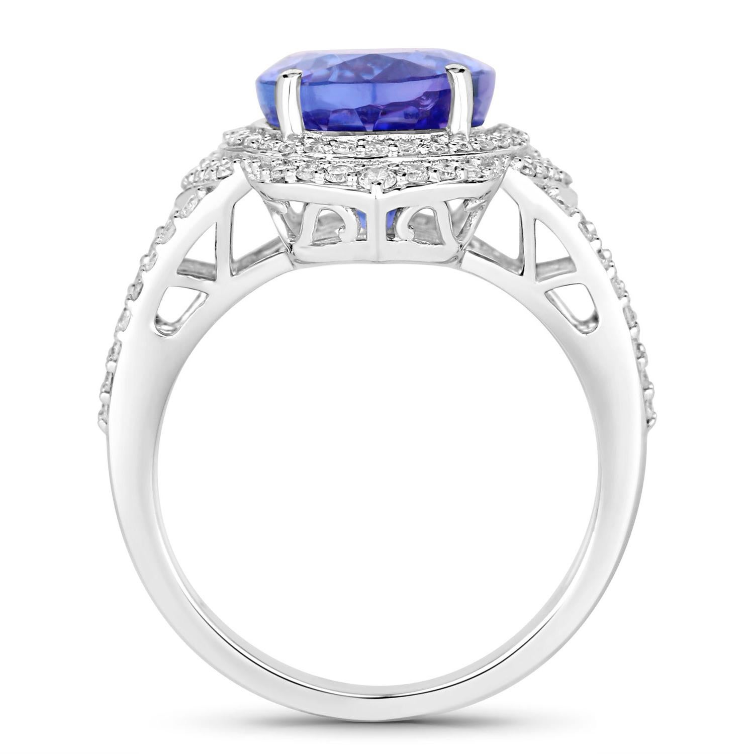 Taglio ovale Anello di tanzanite con diamanti 6,55 carati in oro bianco 14K in vendita