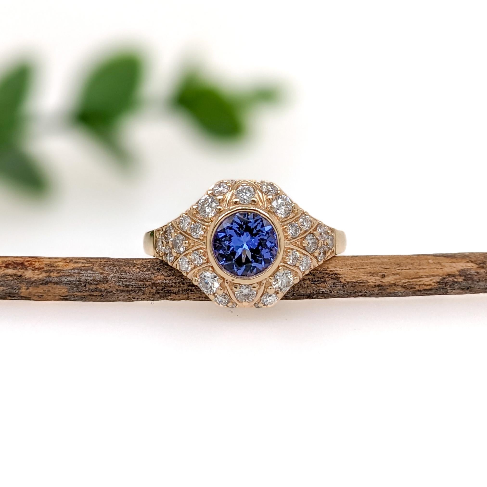 This exquisite ring showcases a 0.86 carat Tanzanite gemstone encircled by a dazzling array of natural earth mined diamonds set in solid 14K gold. This Tanzanite ring makes a beautiful December birthstone gift for your loved