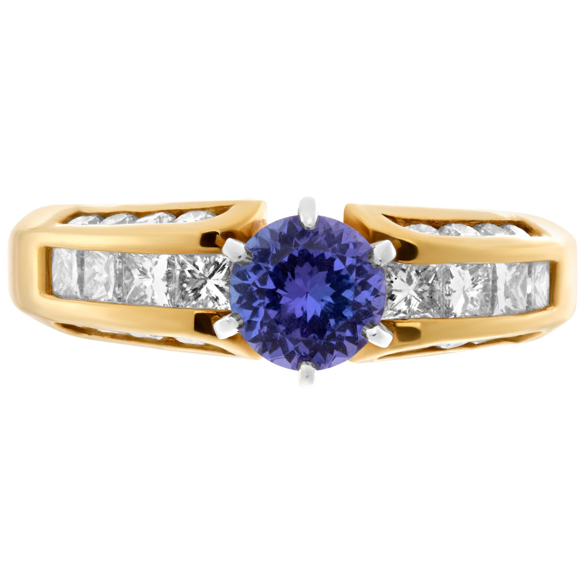 Beautiful tanzanite ring in 18k yellow gold with 0.75 carat tanzanite and 0.75 carats of diamonds accenting top and sides of band. Size 8.25.This Diamond ring is currently size 8.5 and some items can be sized up or down, please ask! It weighs 4.4