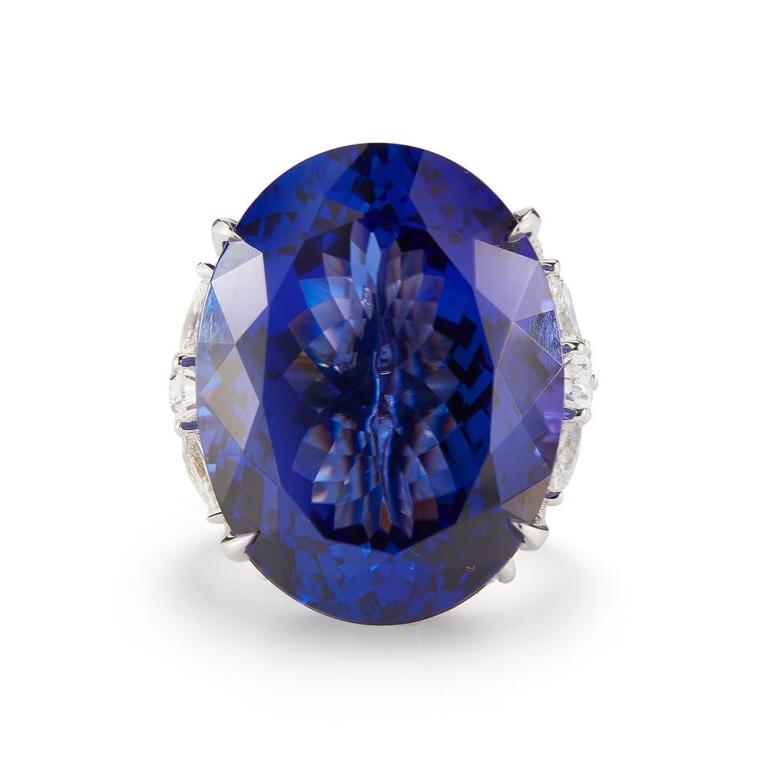 TANZANITE RING WITH DIAMONDS An incomparable basket of certified diamonds is an event on its own; with a spectacular oval Tanzanite in the center it becomes a piece fit for royalty Item: # 01904 Metal: 18k W Lab: Gia Color Weight: 35.30 ct. Diamond