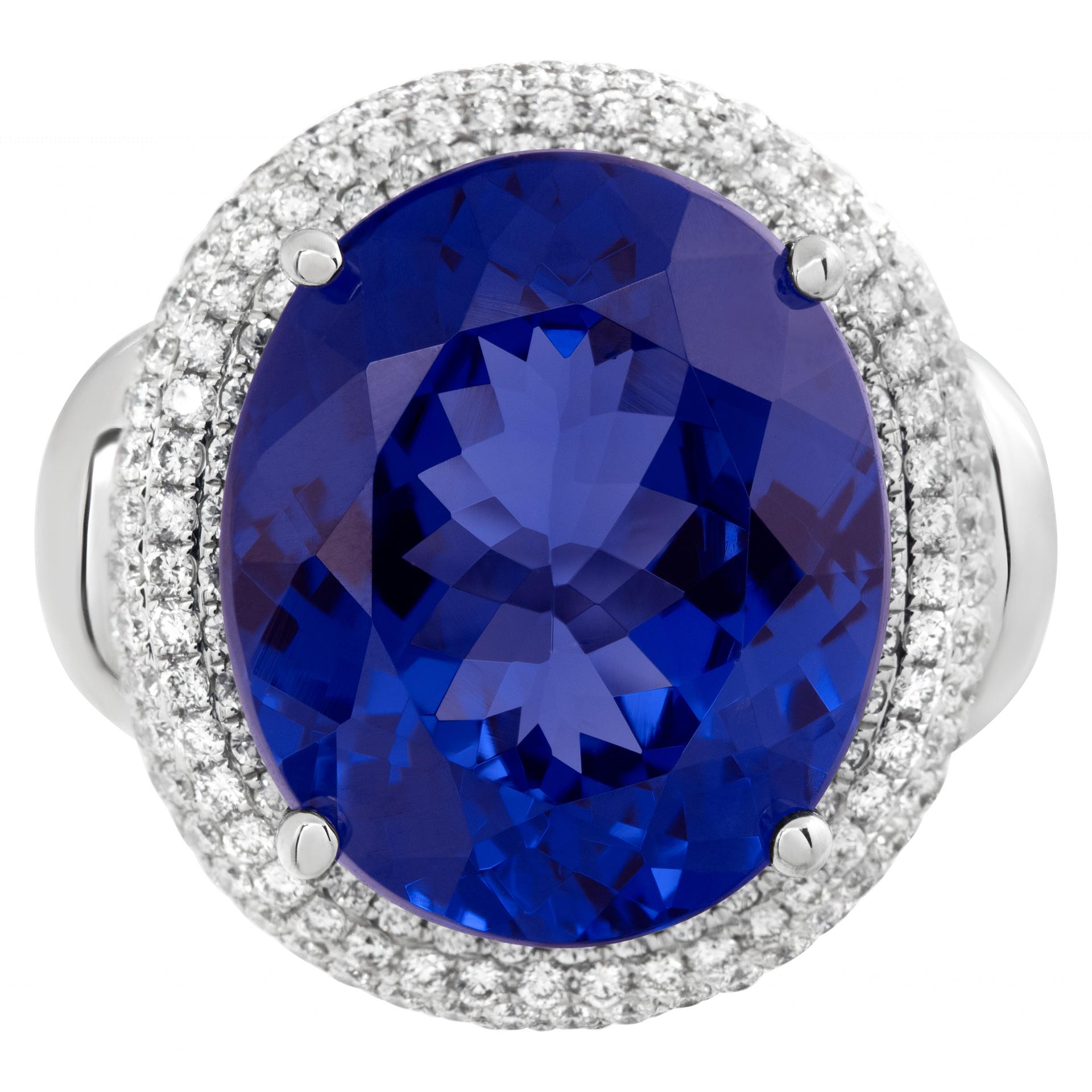 AGL certified Tanzanite and diamond ring in 18k white gold. Brilliant oval cut Tanzanite total approx. weight: 12.80 carats. Round brilliant cut diamonds total approx. weight: 0.99 carat, estimate: H-I color, SI clarity. 20 x 20mm. Ring size 6.This