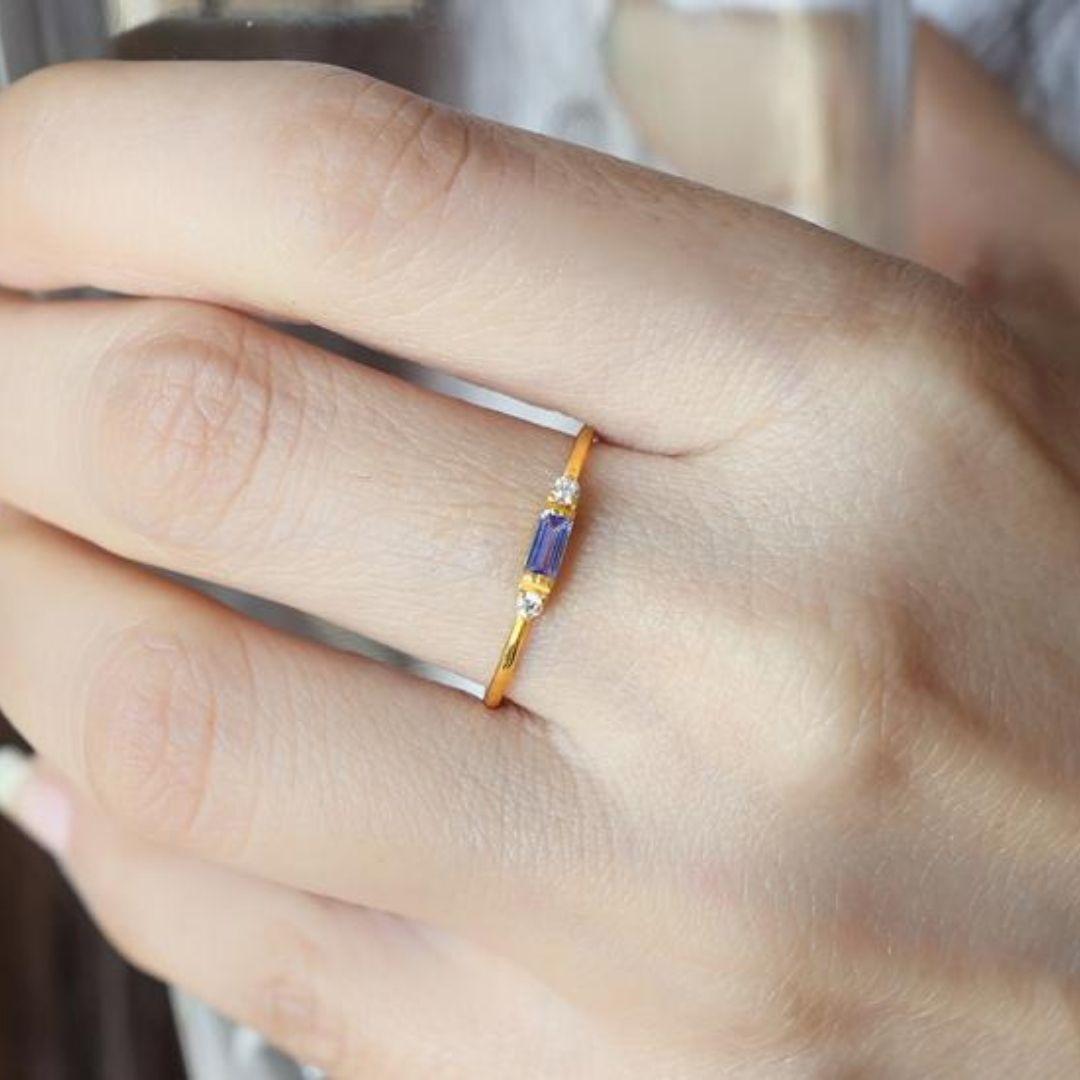 Handmade item
Materials: Gold, Rose gold, White gold
Gemstone: Tanzanite
Gem color: Blue
Band Color: Gold
Style: Minimalist

Dainty everyday jewelry, a stackable ring embellished by baguette tanzanite, and small diamonds. Engagement band, knuckle