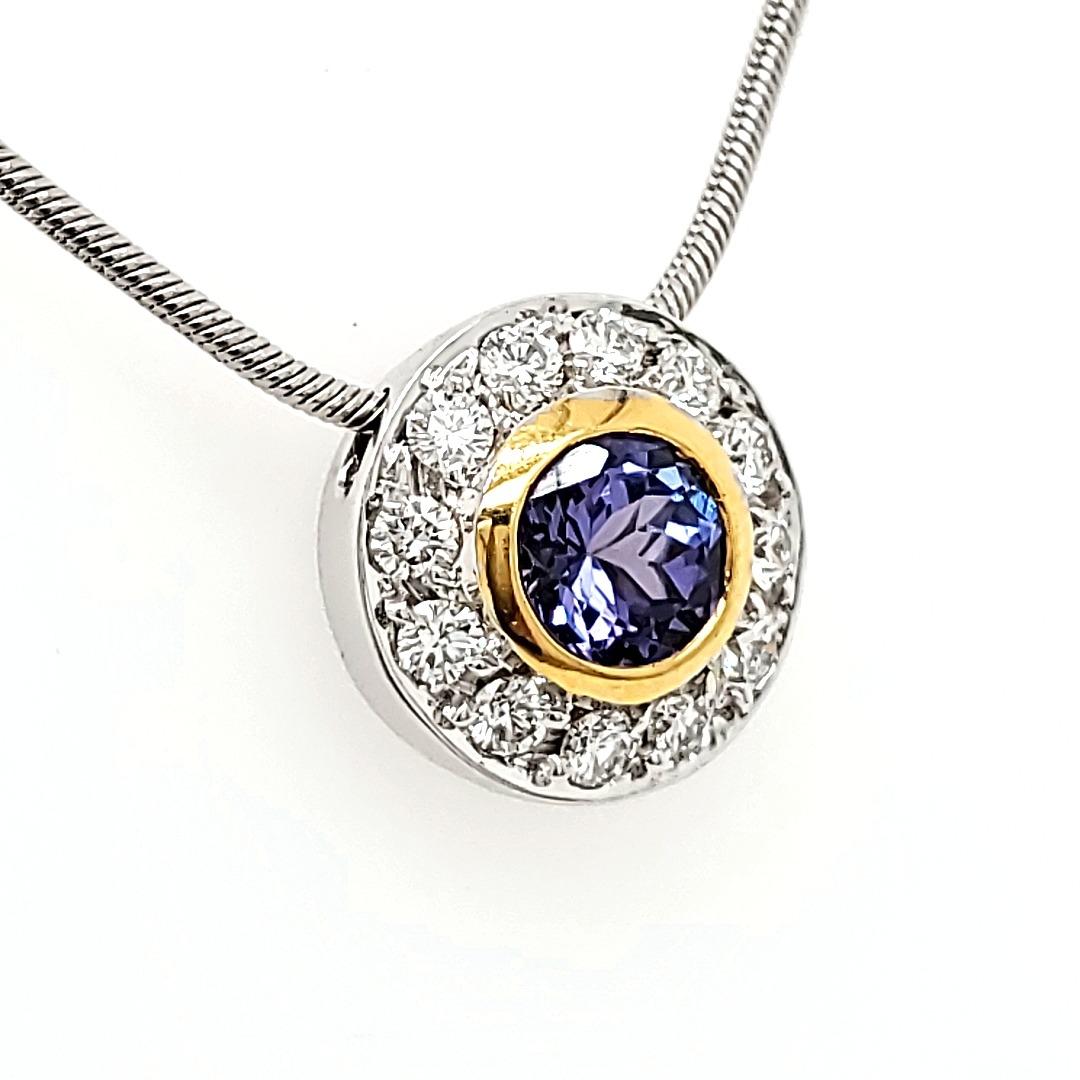 Tanzanite Round Pendant in 18 K gold chain

Many a times, it is simplicity that draws attention and this is what this pendant displays : a touch of class and a strikingly beautiful face but it is still totally unassuming.

Worn in the day, it