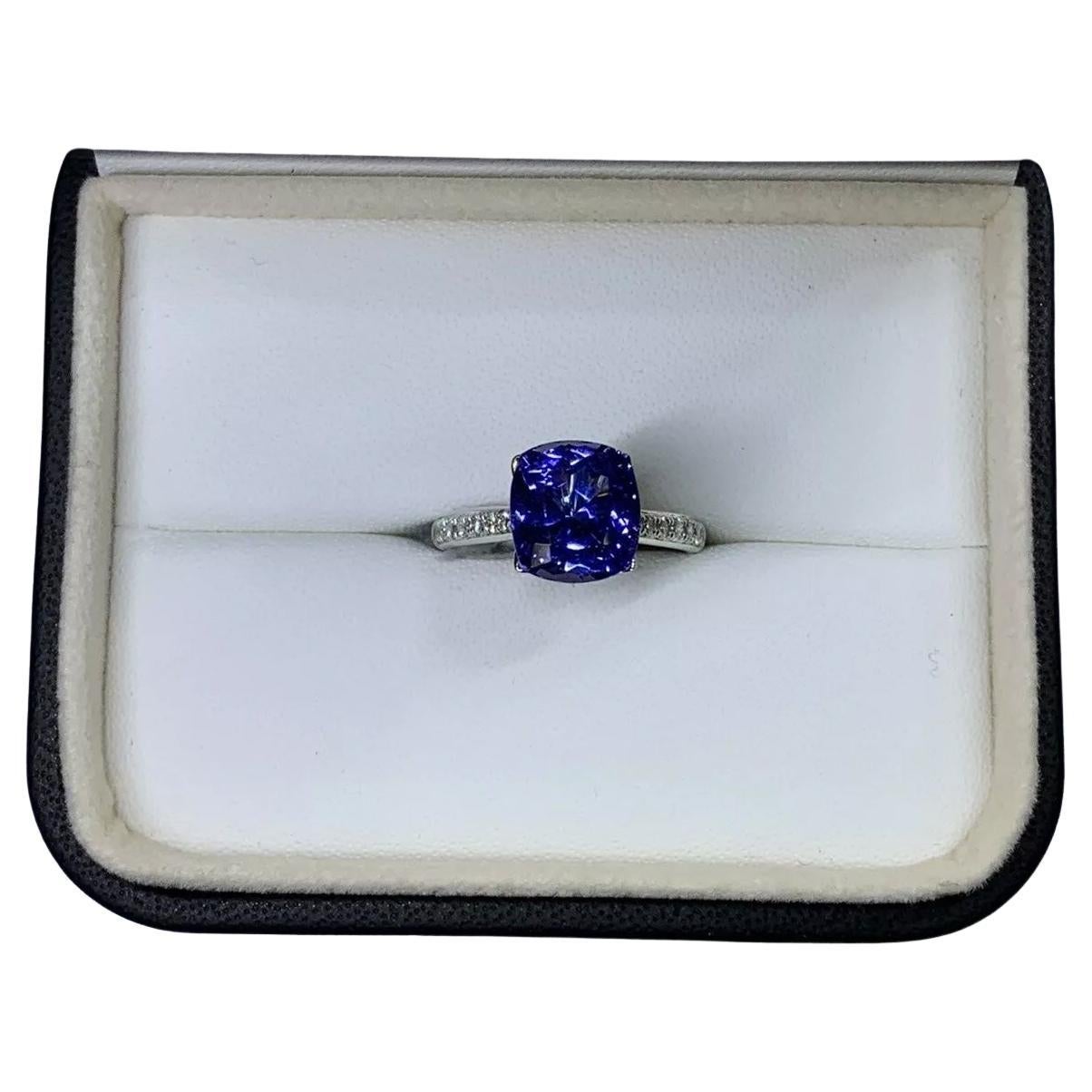 Tanzanite royal blue and diamond engagement ring in 18k white gold.
