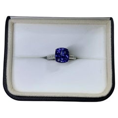 Tanzanite royal blue and diamond engagement ring in 18k white gold.