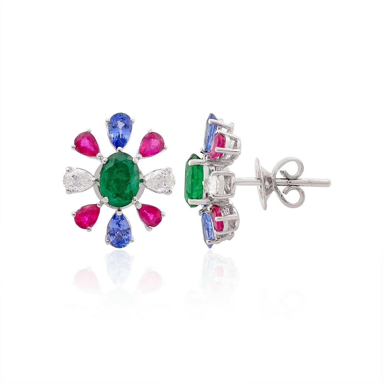 Cast in 14 karat white gold, these stunning stud earrings are hand set with 4.02 carats tanzanite, ruby, emerald and .56 carats of glimmering diamonds. 

FOLLOW MEGHNA JEWELS storefront to view the latest collection & exclusive pieces. Meghna Jewels