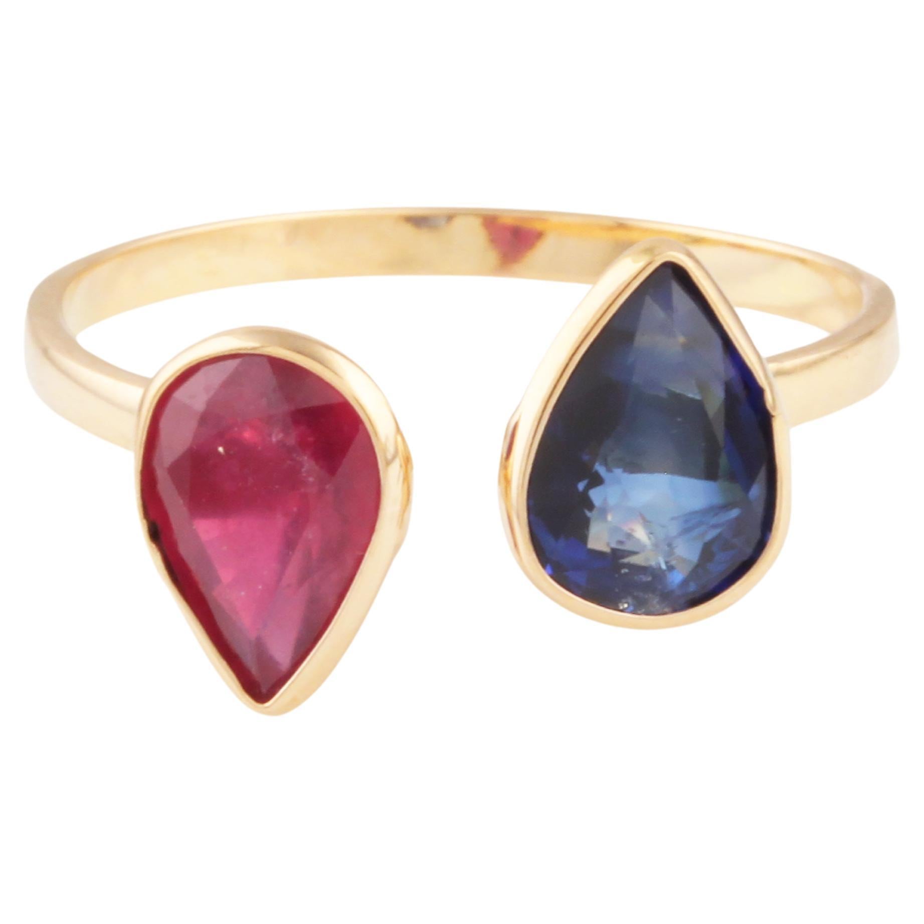 Anillo en forma de pera de tanzanita y rubí en oro amarillo de 18 quilates en venta
