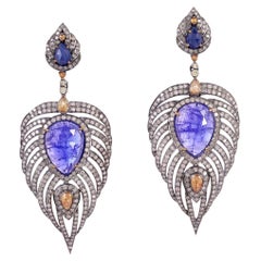 Orecchini con piuma di tanzanite, zaffiro e diamante