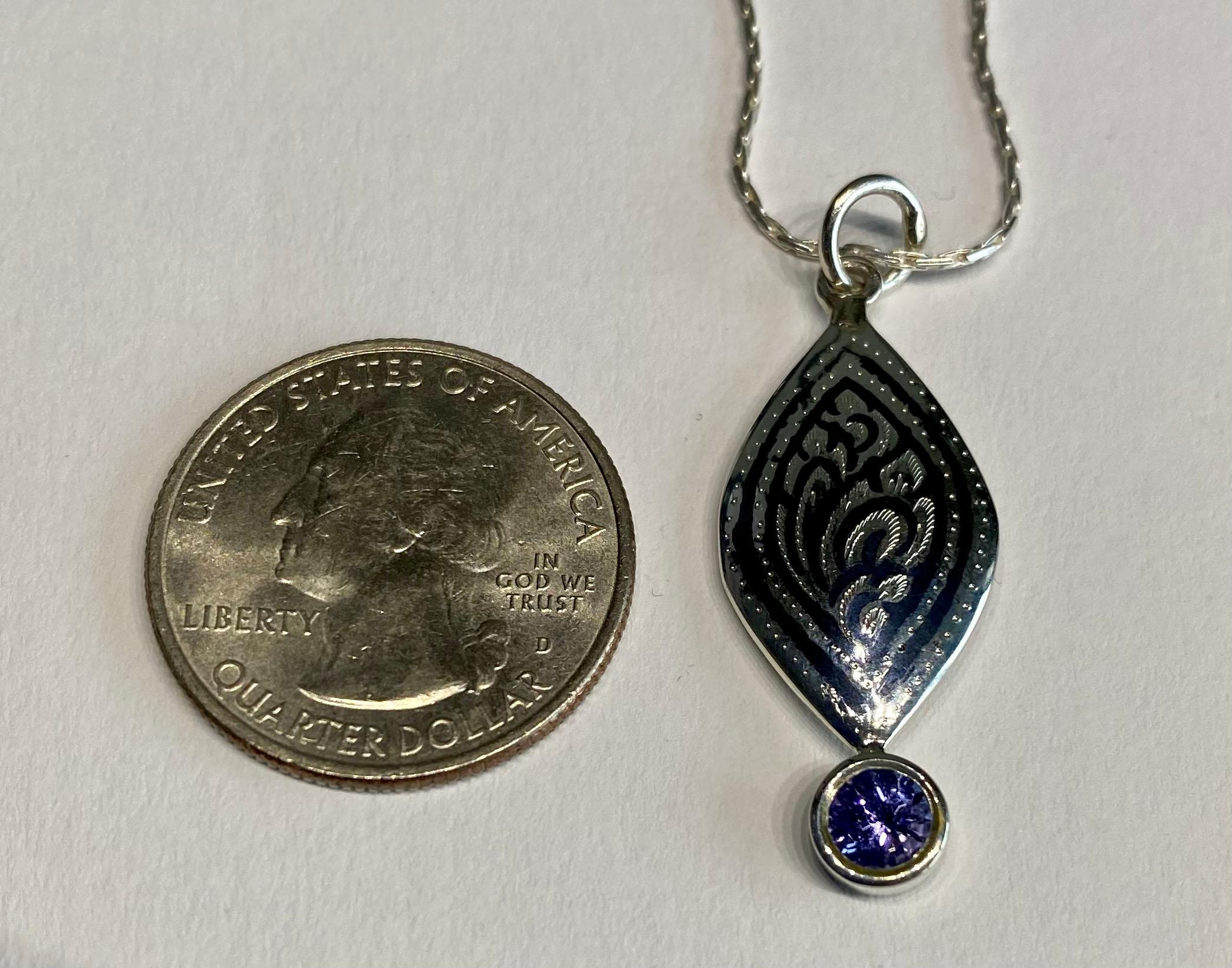 A Silver Filagree Pendant set with a 5MM Round Tanzanite  For Sale 5