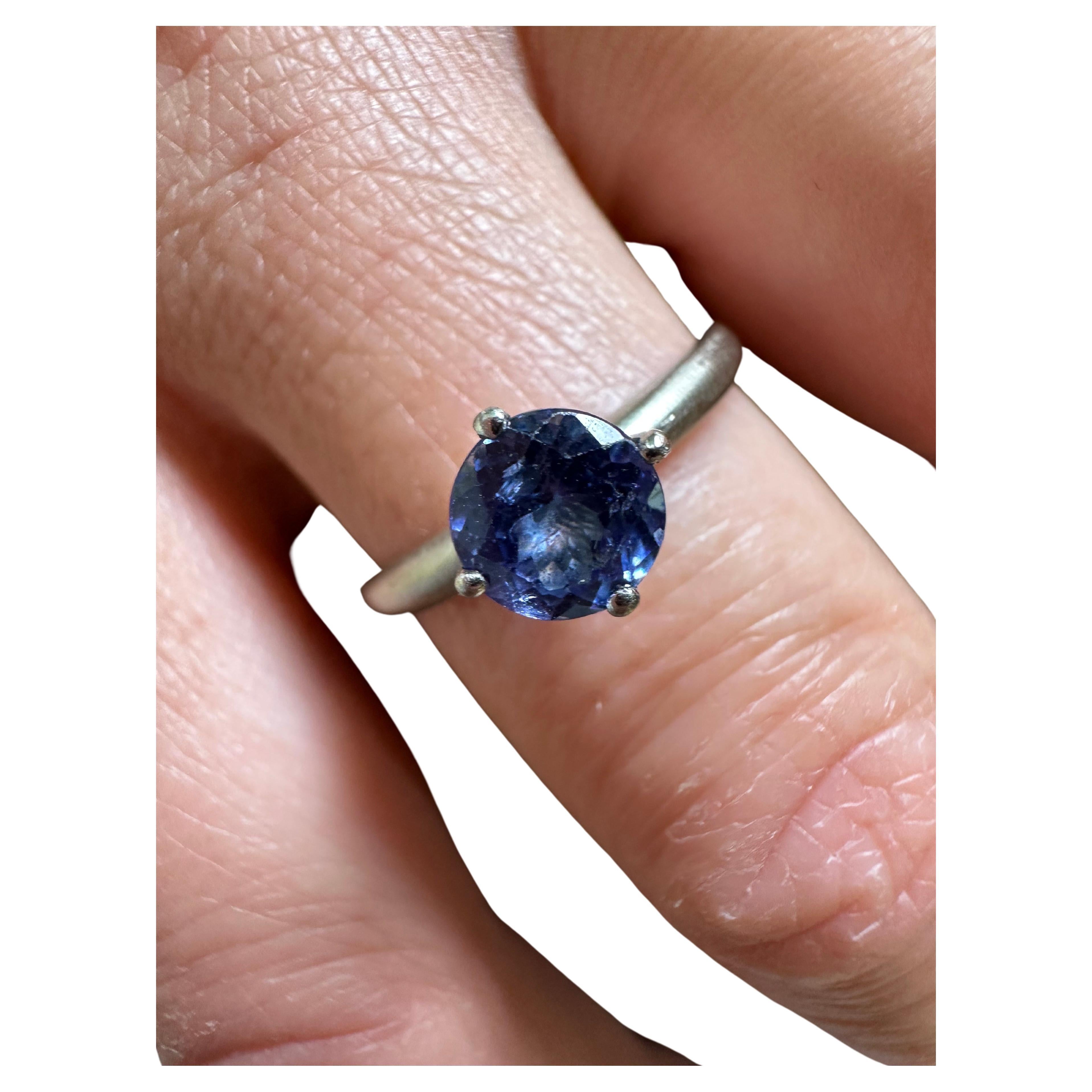 Unique tanzanite engagement ring made in a solitaire style with matte finish. The ring is modern sized at 9 (can be re-sized) artist unknown.

Metal Type: 14KT

Natural Tanzanite(s):
Color: Violet
Cut: Round
Carat: 1ct
Clarity: Moderately