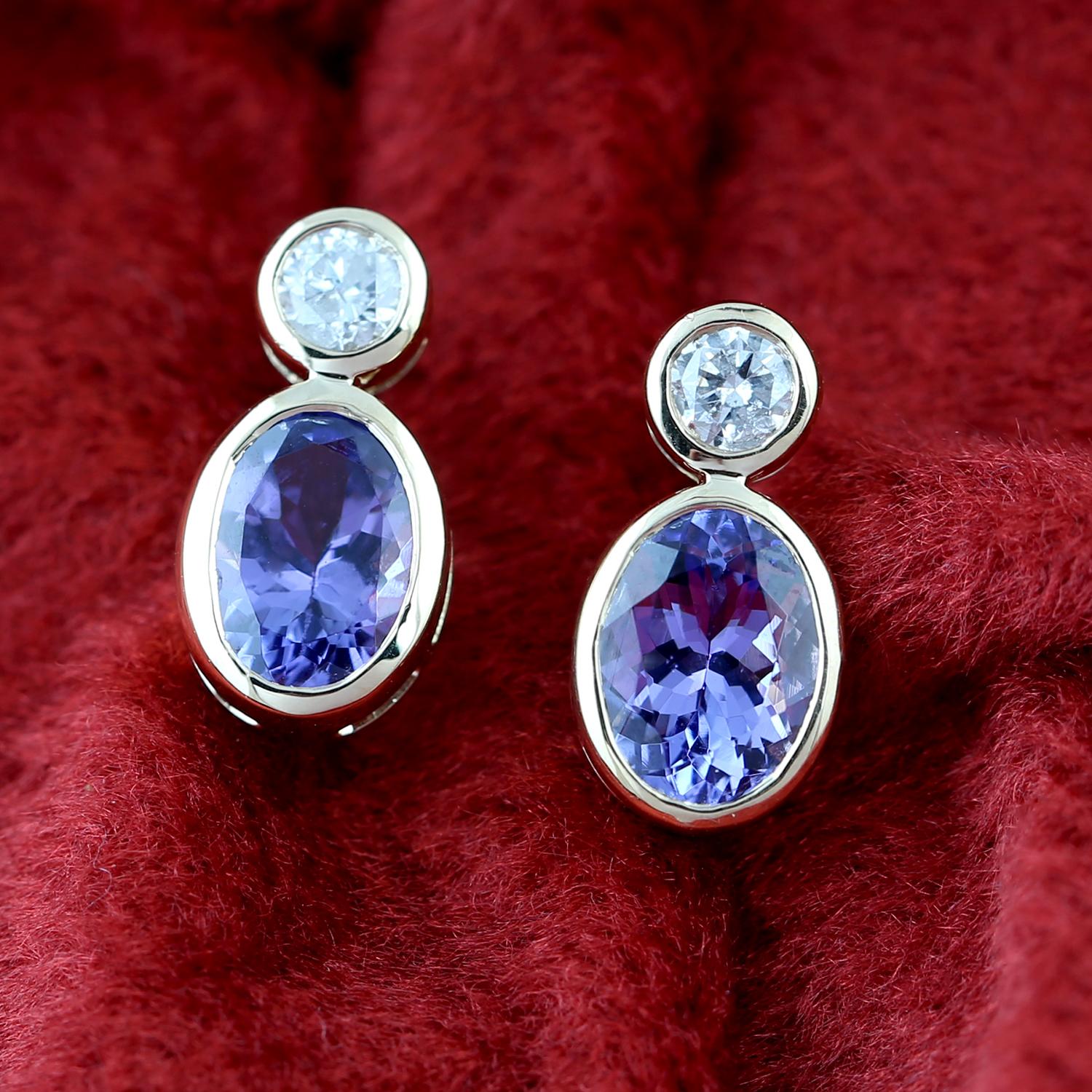 Art Deco Oval Shaped Blue Tanzanite Stud Earrings with Diamonds Made in 18k Gold For Sale
