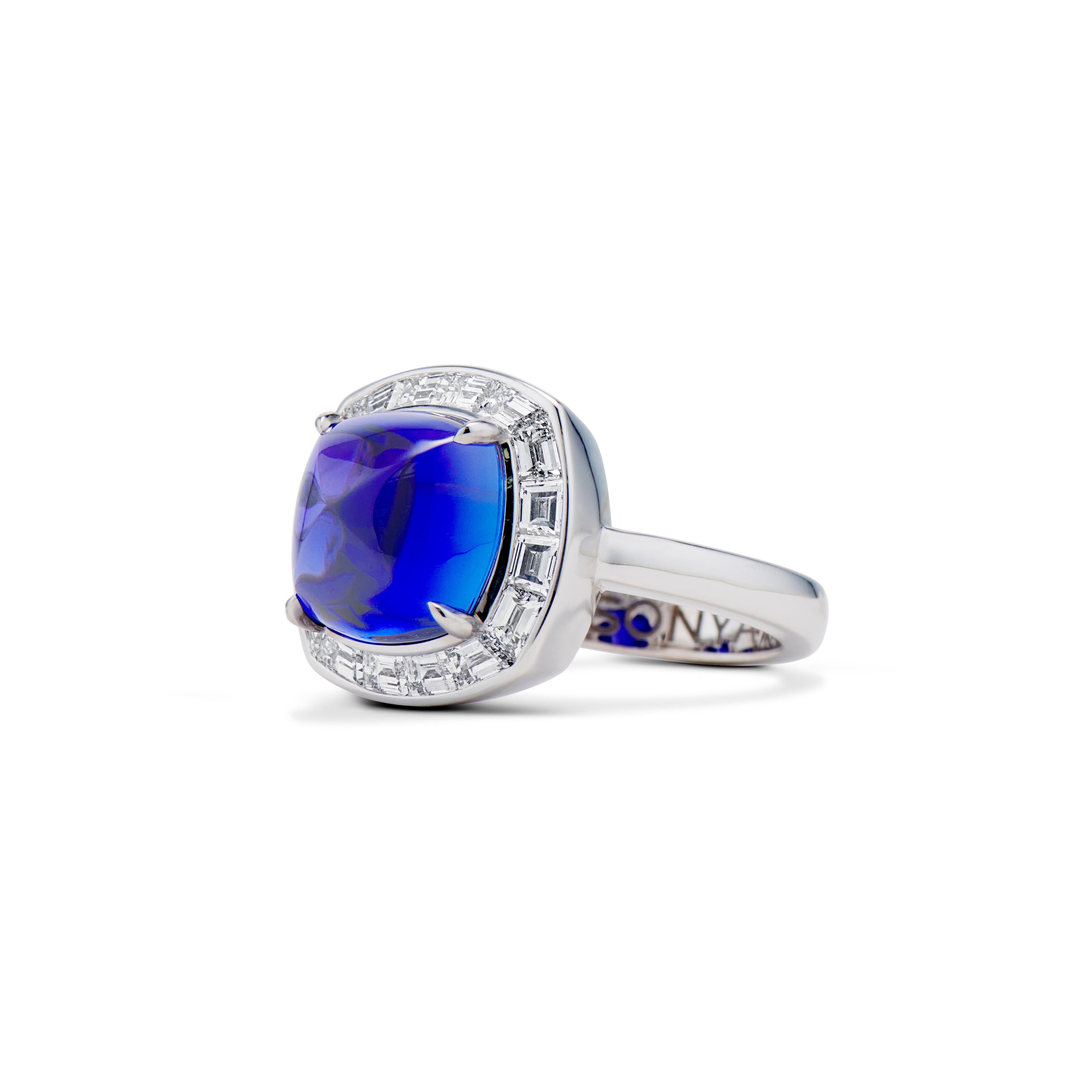 The centerpiece of the ring is a 5.62 ct Tanzanite sugarloaf with a rich violet-blue color that gives it a royal feeling. The main stone is surrounded by 1.52 ct D-F VS baguette-cut diamonds.

The ring is handcrafted in 18K white gold.

Ring size: