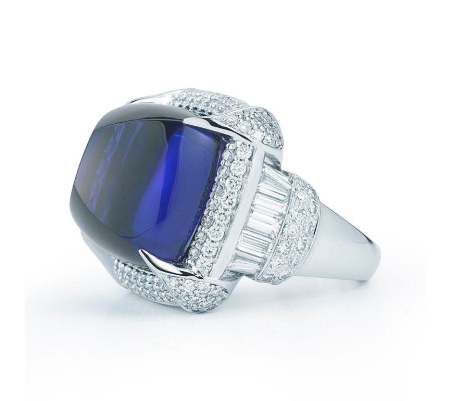 TANZANITE SUGARLOAF RING WITH DIAMONDS A distinguished sugarloaf Tanzanite in a beautifully simple diamond pave setting. Item: # 01679 Metal: 18k W Color Weight: 33.88 ct. Diamond Weight: 3.12 ct.
