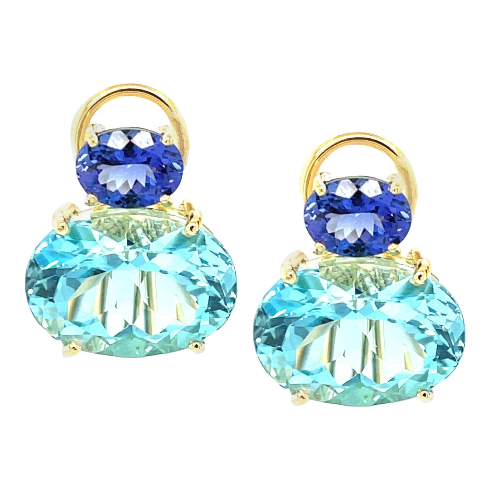 Boucles d
oreilles Tanzanite 
Topaze bleue suisse en or jaune 18k avec dos Omega
