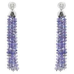 Orecchini con nappe di tanzanite in oro bianco 14K e borchie con diamanti