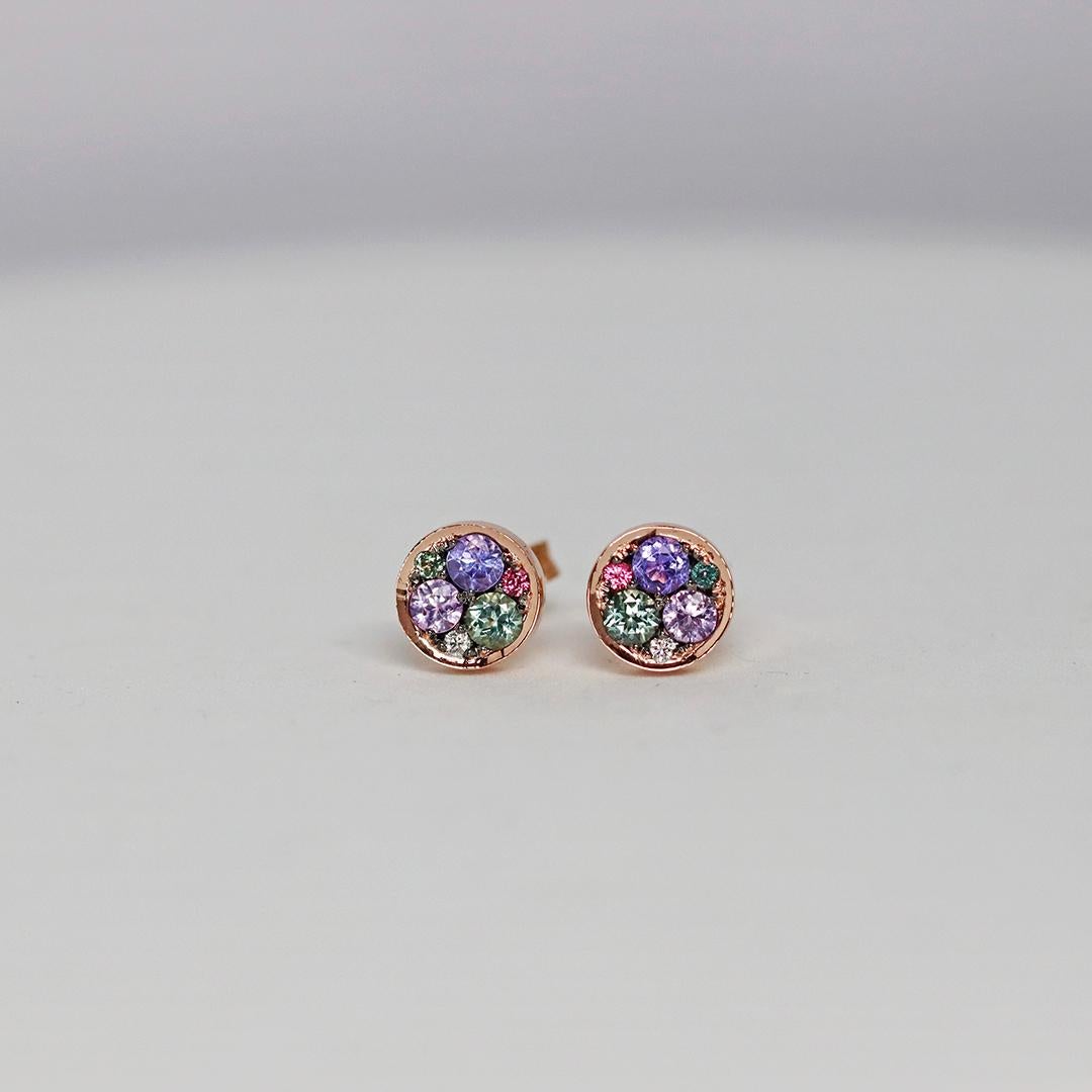 Handmade in Belgium by jewellery artist Joke Quick, these 18 K rose gold stud earrings display mesmerizing Tanzanites, mint Tourmalines and pink Tourmalines, Paraiba Tourmalines, unheated blue sapphires and intense Pink Spinels, meticulously set in