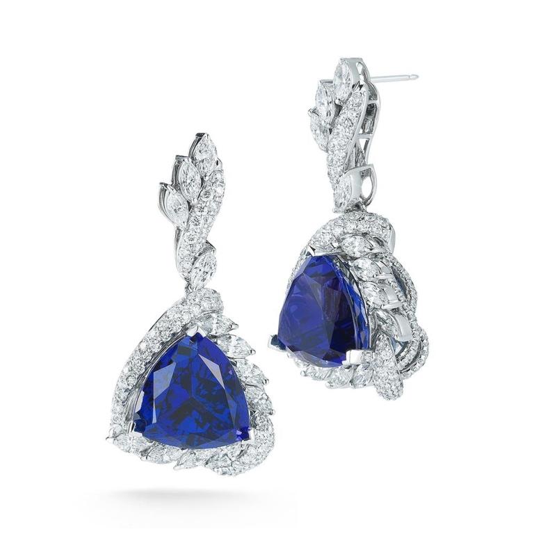 TANZANITE TRILLION EARRING Dramatic and decadent, these diamond encrusted Tanzanite trillions are a vibrant statement. Item: # 01794 Metal: 18k W Lab: Gia Color Weight: 31.14 ct. Diamond Weight: 6.92 ct.
