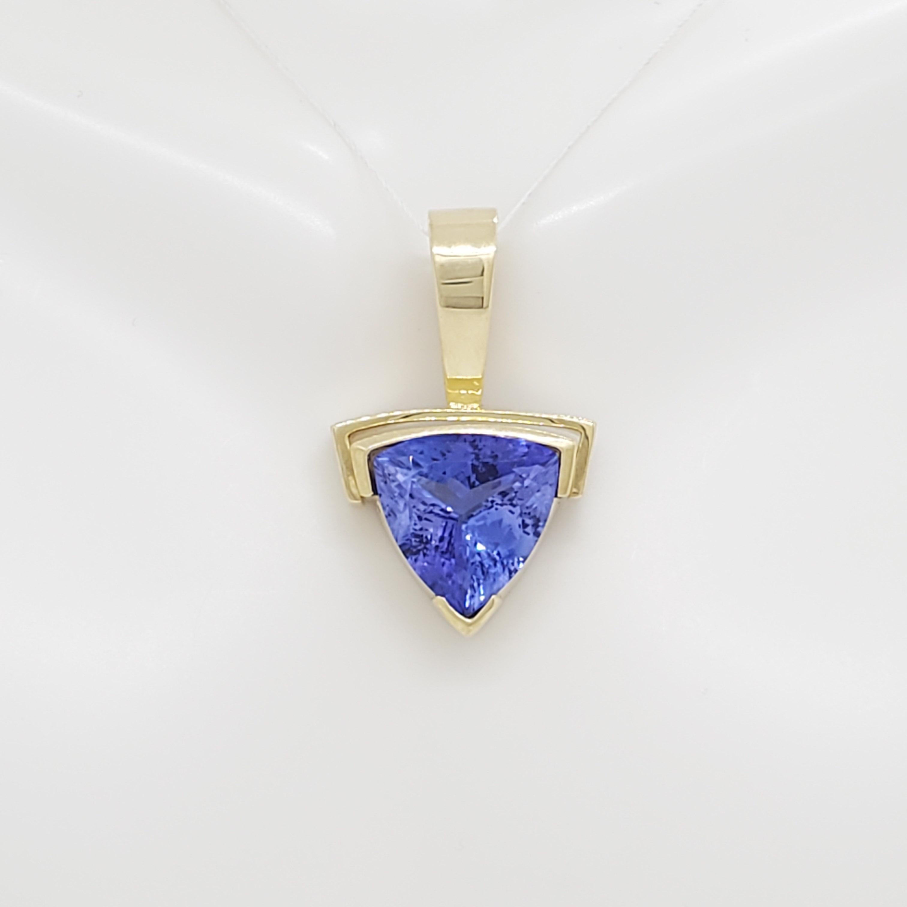 Gorgeous 8.14 ct. tanzanite trillion pendant handmade in 14k yellow gold.  Quality of tanzanite is excellent and size is substantial.