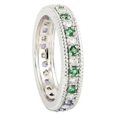 Bague d'éternité en or 18 carats avec tanzanite, tsavorite et diamant