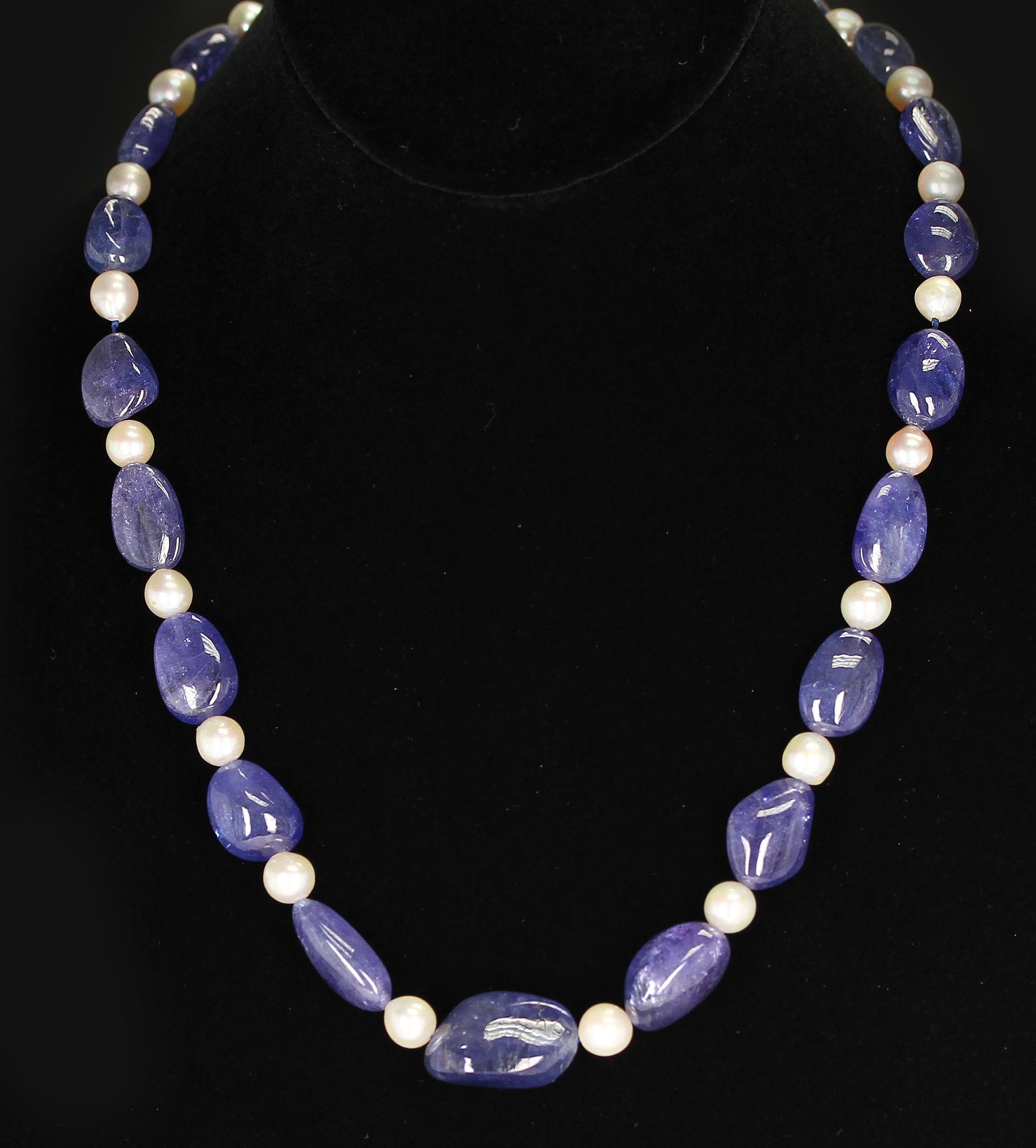A fine strand of smooth Tanzanite Tumbled Beads & Pearls with a 14K Yellow Gold Clasp. Clasp can be changed according to preference. Weight: 340 cts., Length: 20 inches.