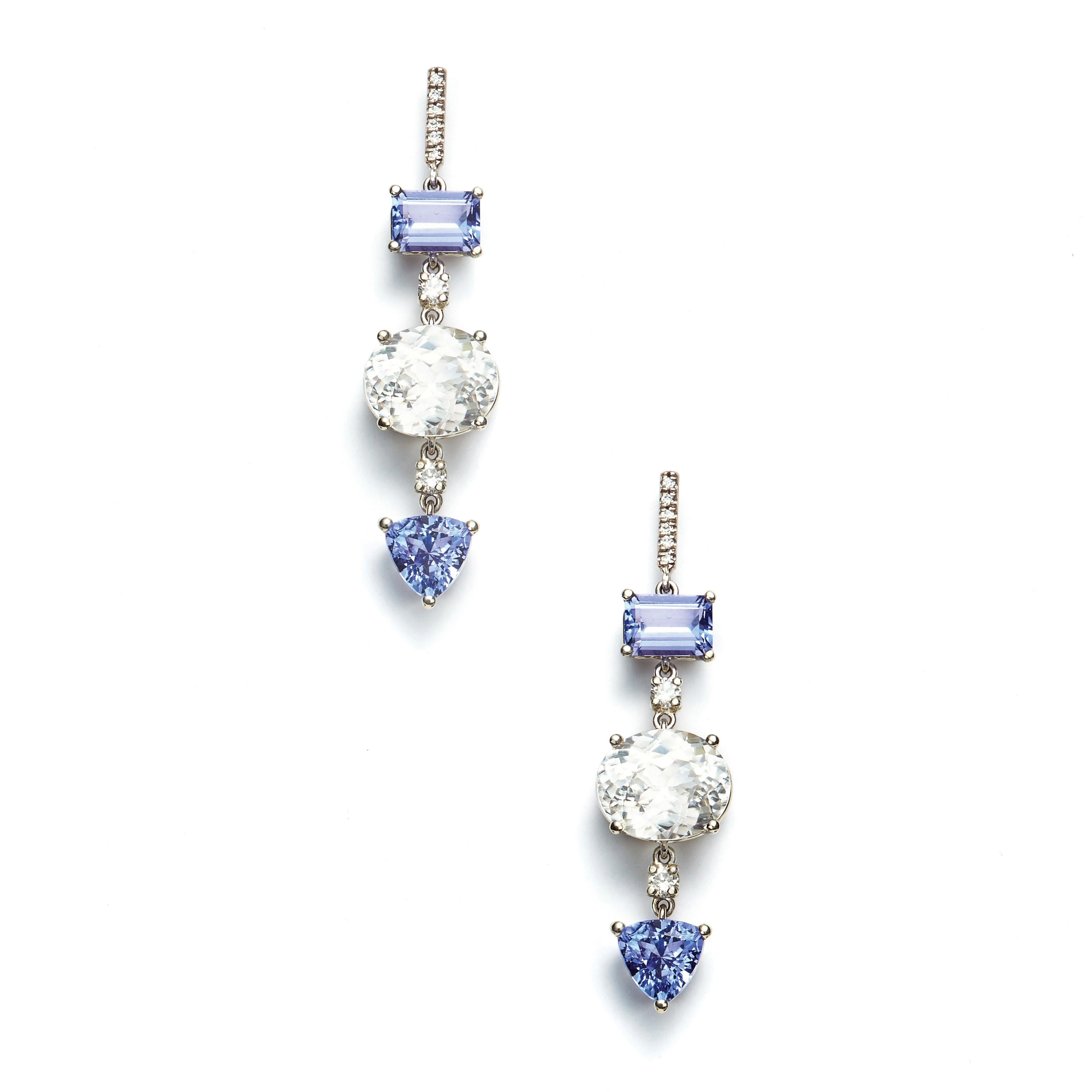 The beautiful hue of Tanzanite, set in 18 Karat White Gold, stands out in these 2.22 Carat stones and is amplified by the sparkle of White Zircons* and Diamonds. Truly an exceptional piece of jewelry.

Diamonds: 2.4 Carat
White Zircon*: 10.37