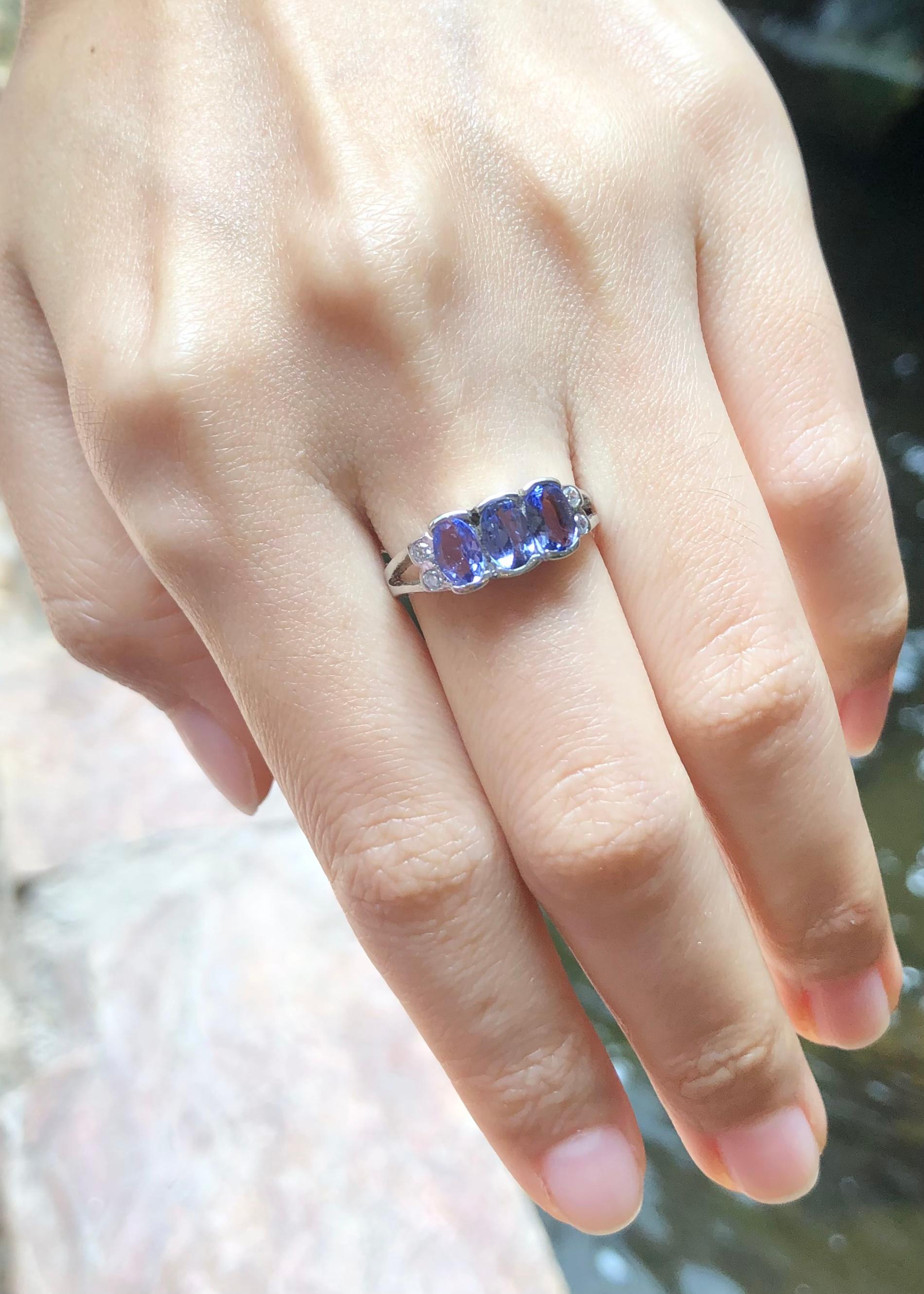 Tanzanite with Cubic Zirconia Ring set in Silver Settings

Width:  1.2 cm 
Length: 0.7 cm
Ring Size: 54
Total Weight: 2.86 grams

*Please note that the silver setting is plated with rhodium to promote shine and help prevent oxidation.  However, with