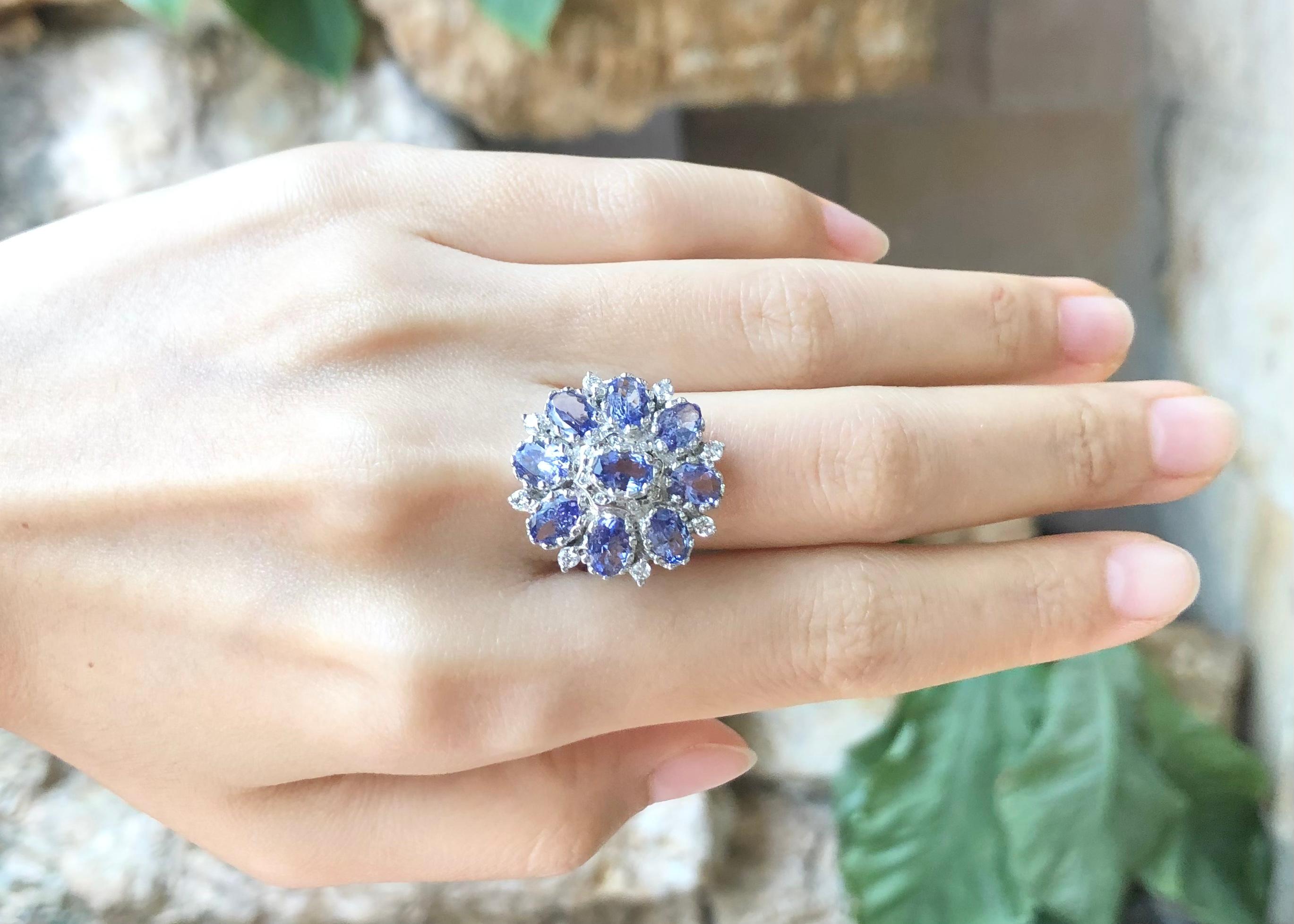 Tanzanite with Cubic Zirconia Ring set in Silver Settings

Width:  2.2 cm 
Length: 2.2 cm
Ring Size: 58
Total Weight: 6.78 grams

*Please note that the silver setting is plated with rhodium to promote shine and help prevent oxidation.  However, with