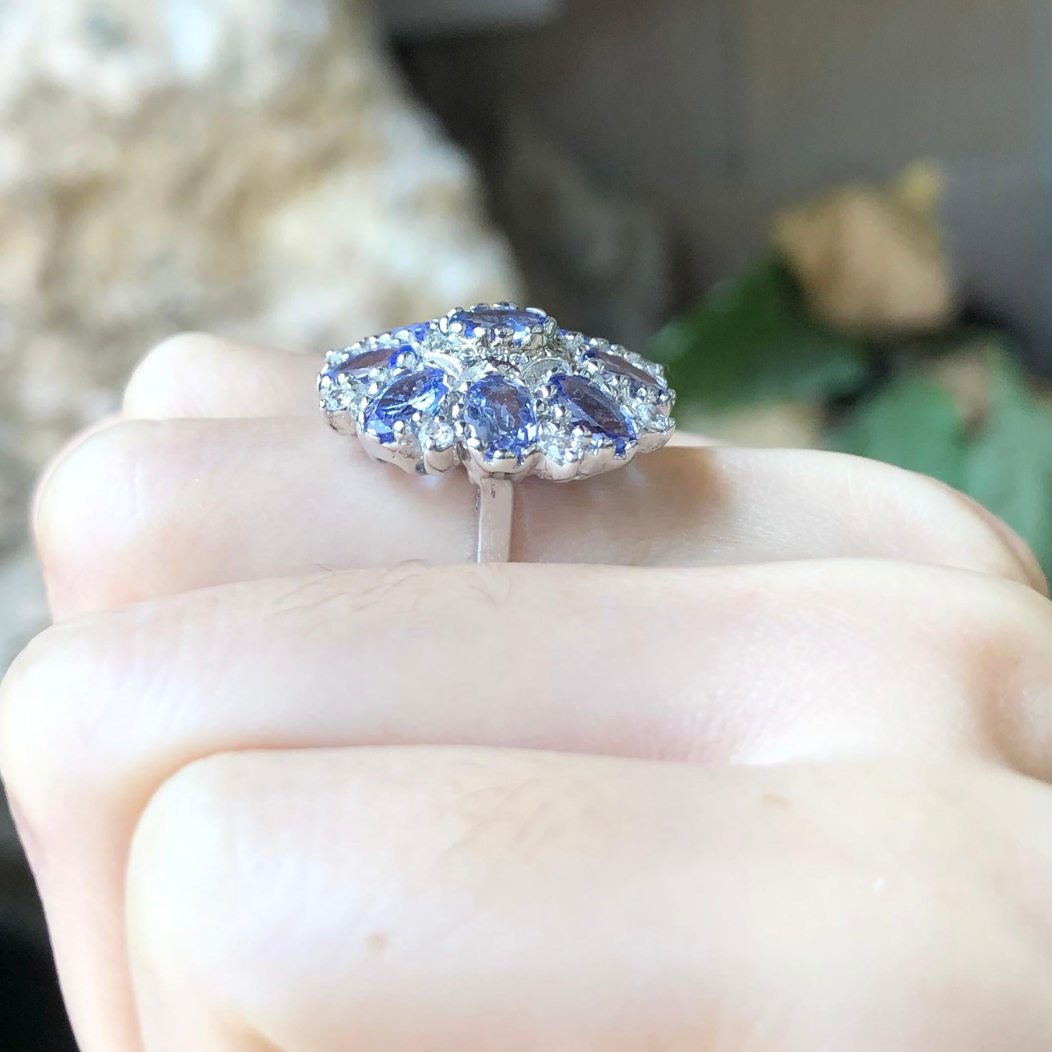 Contemporary Tanzanite with Cubic Zirconia Ring set in Silver Settings For Sale