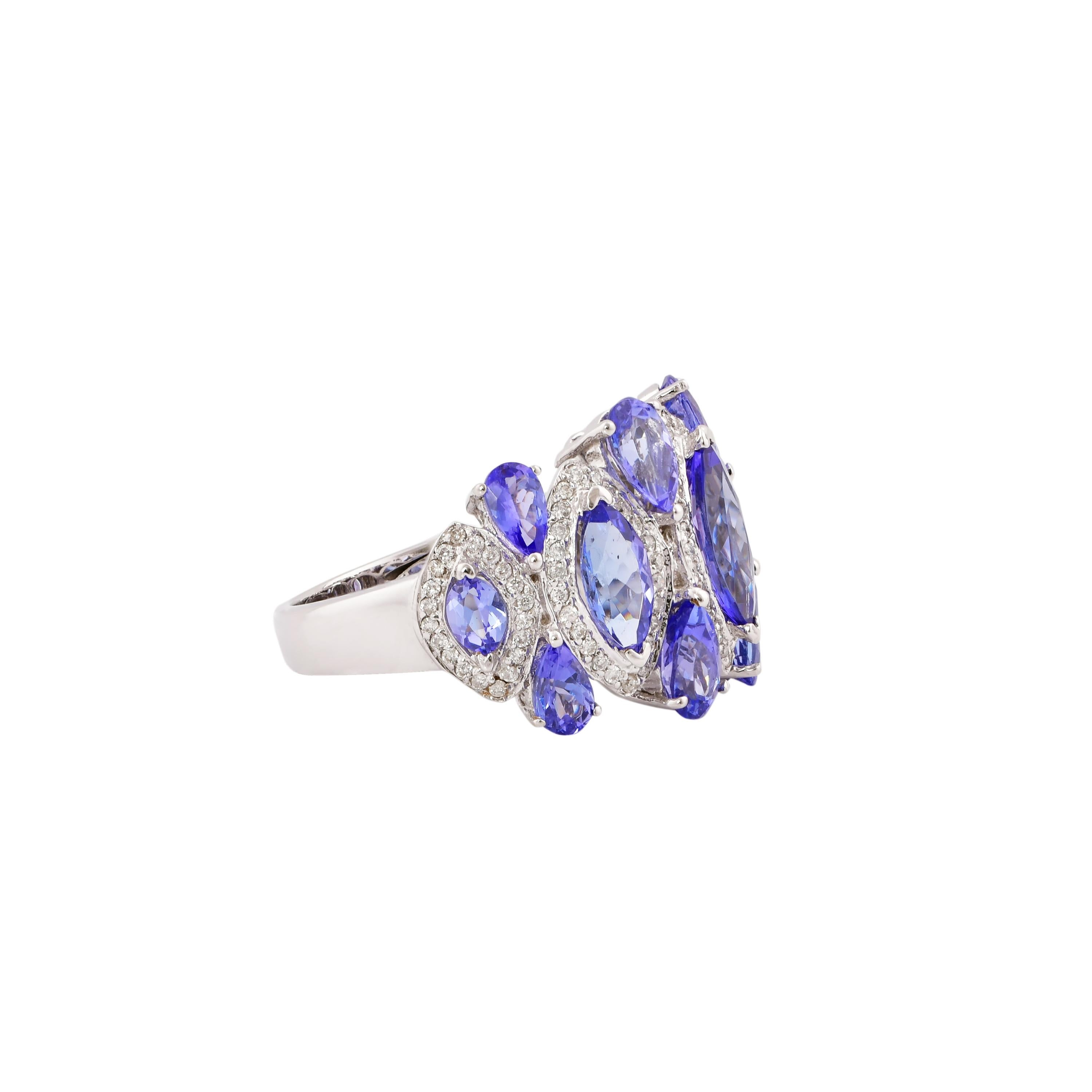 Sunita Nahata presents a collection of fancy cocktail rings with gorgeous gemstones. This ring uniquely pairs pear and marquise shaped tanzanites accented with diamonds. The banded design makes the a striking yet subtle cocktail ring that will