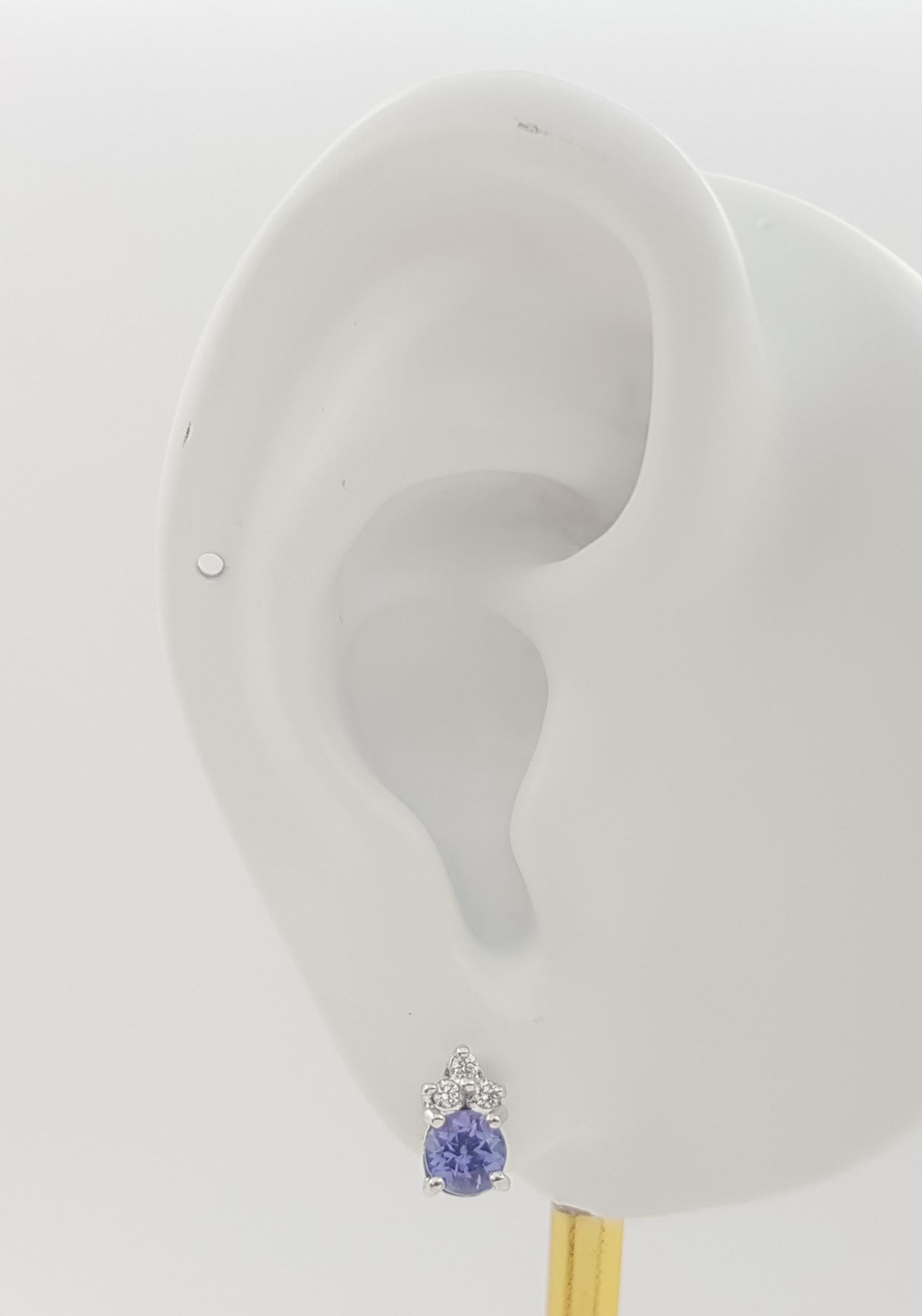 Tanzanite 0.83 carat with Diamond 0.06 carat Earrings set in 18K White Gold Settings

Width: 0.4 cm 
Length: 0.8 cm
Total Weight: 3.47 grams


