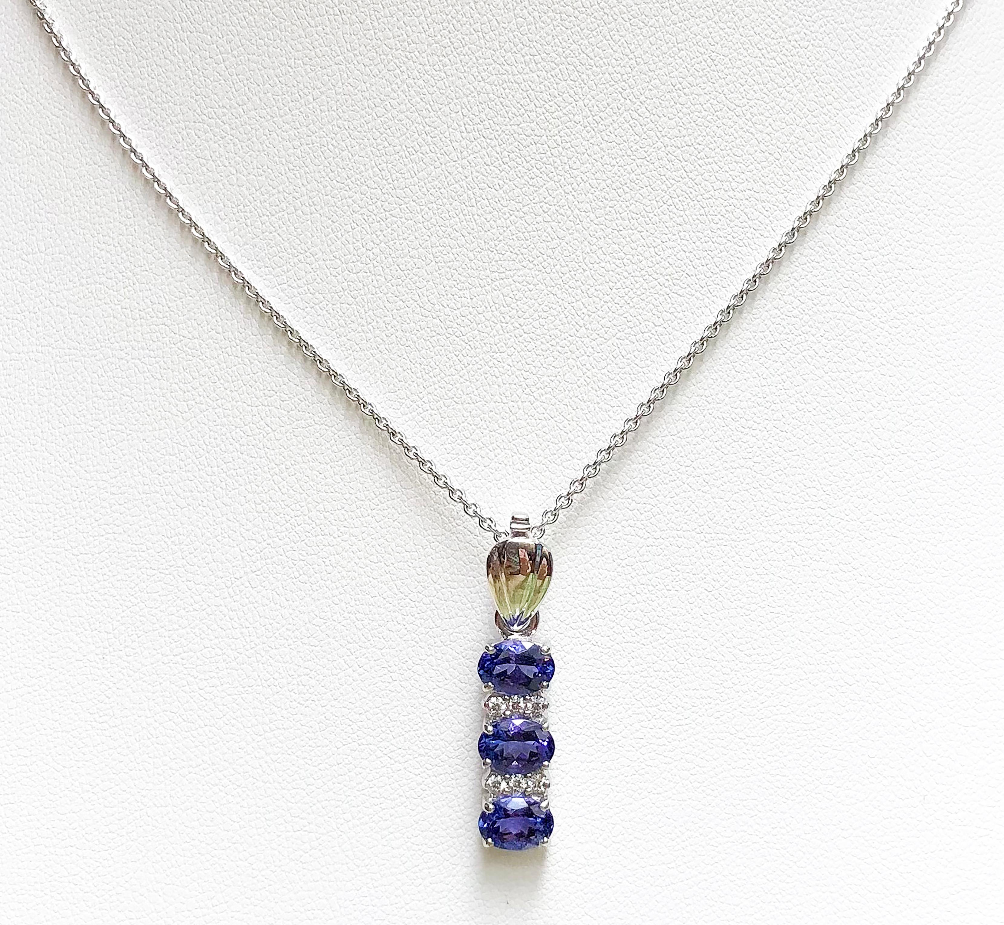 Tanzanite 2.73 carats with Diamond 0.12 carat Pendant set in 18 Karat White Gold Settings
(chain not included)

Width:  0.6 cm 
Length: 3.0 cm
Total Weight: 4.83 grams

