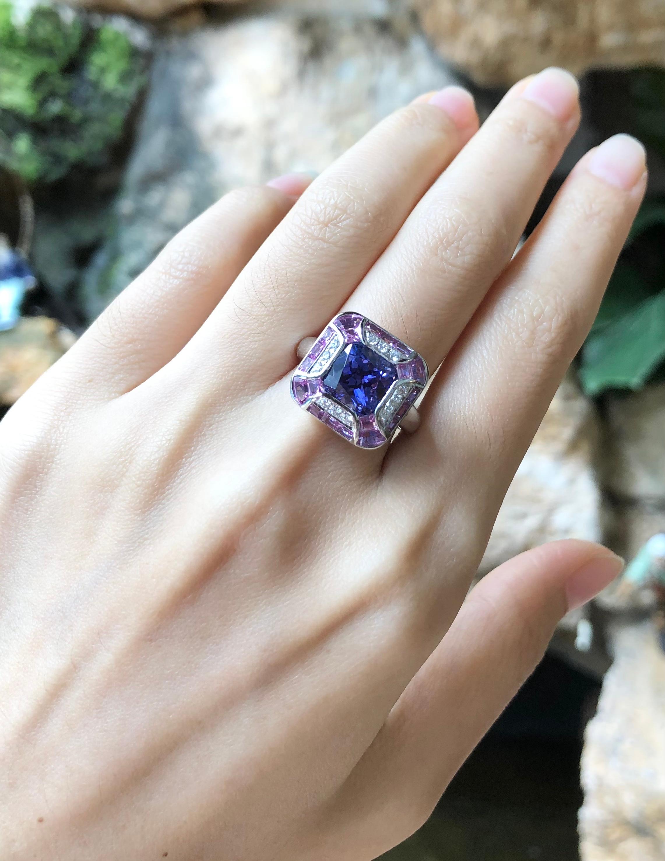 Tanzanite 3.36 carats with Pink sapphire 2.61 carats and Diamond 0.14 carat Ring set in 18 Karat White Gold Settings

Width:  1.6 cm 
Length:  1.6 cm
Ring Size: 53
Total Weight: 10.61 grams

