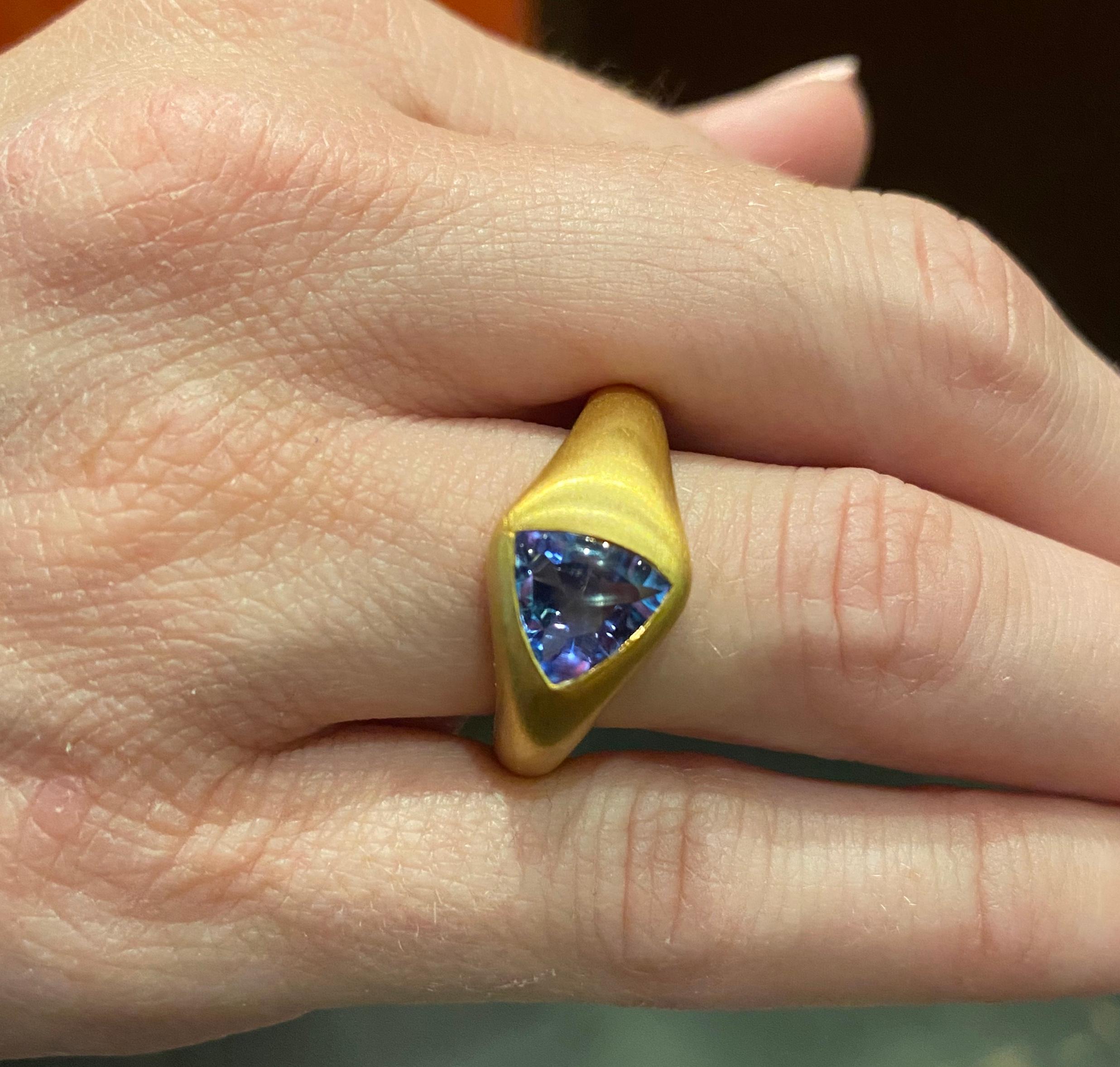 Handmade Ring crafted in 22k Yellow Gold set with a Trillion Tanzanite weighing 4 carats. 


