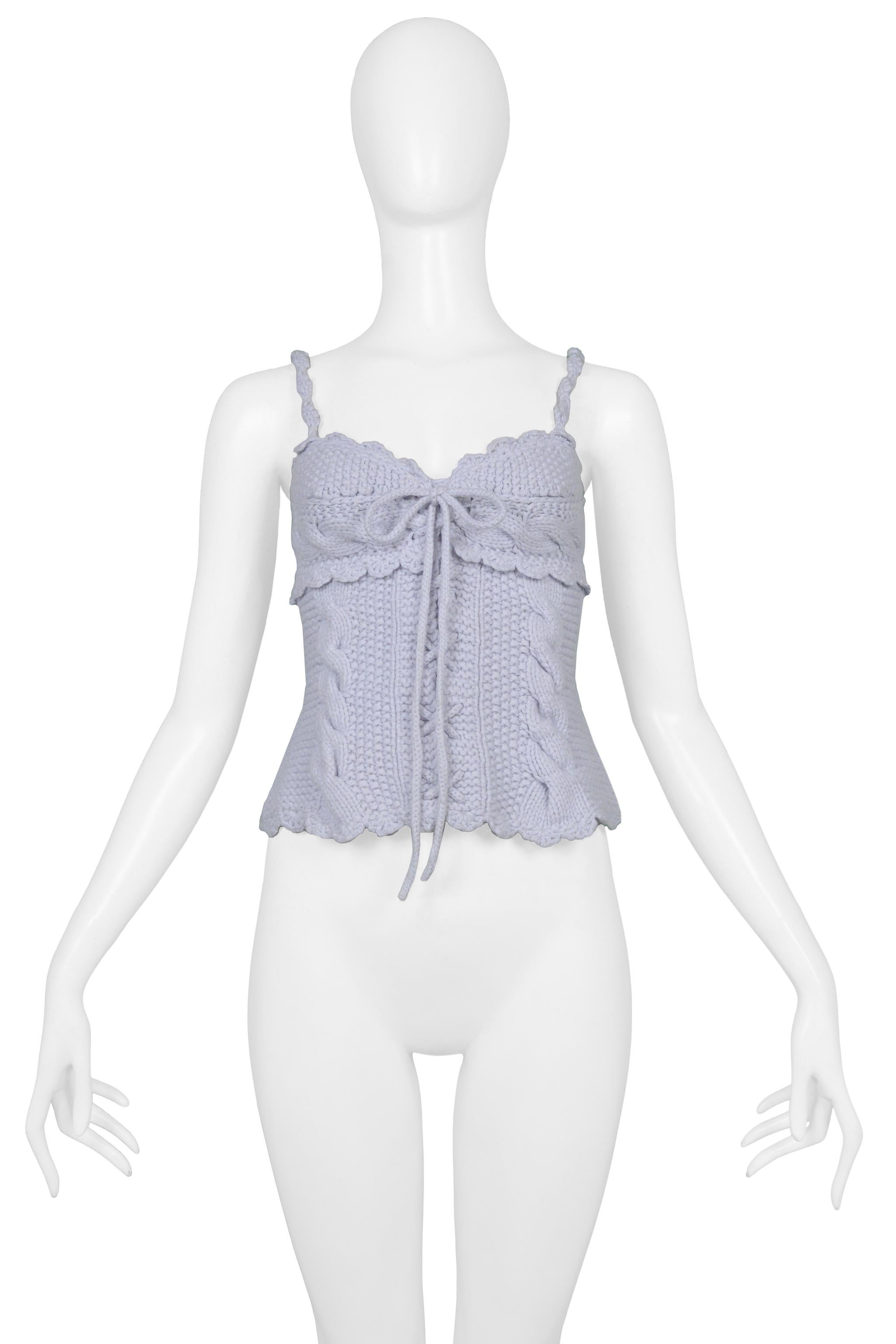 Resurrection Vintage is excited to offer a vintage Tao for Comme des Garcons light blue knitted corset top featuring cable knit panels, front criss-cross laces with tie, knitted straps, and scalloped edges. From the 2005 collection. 

Tao For Comme