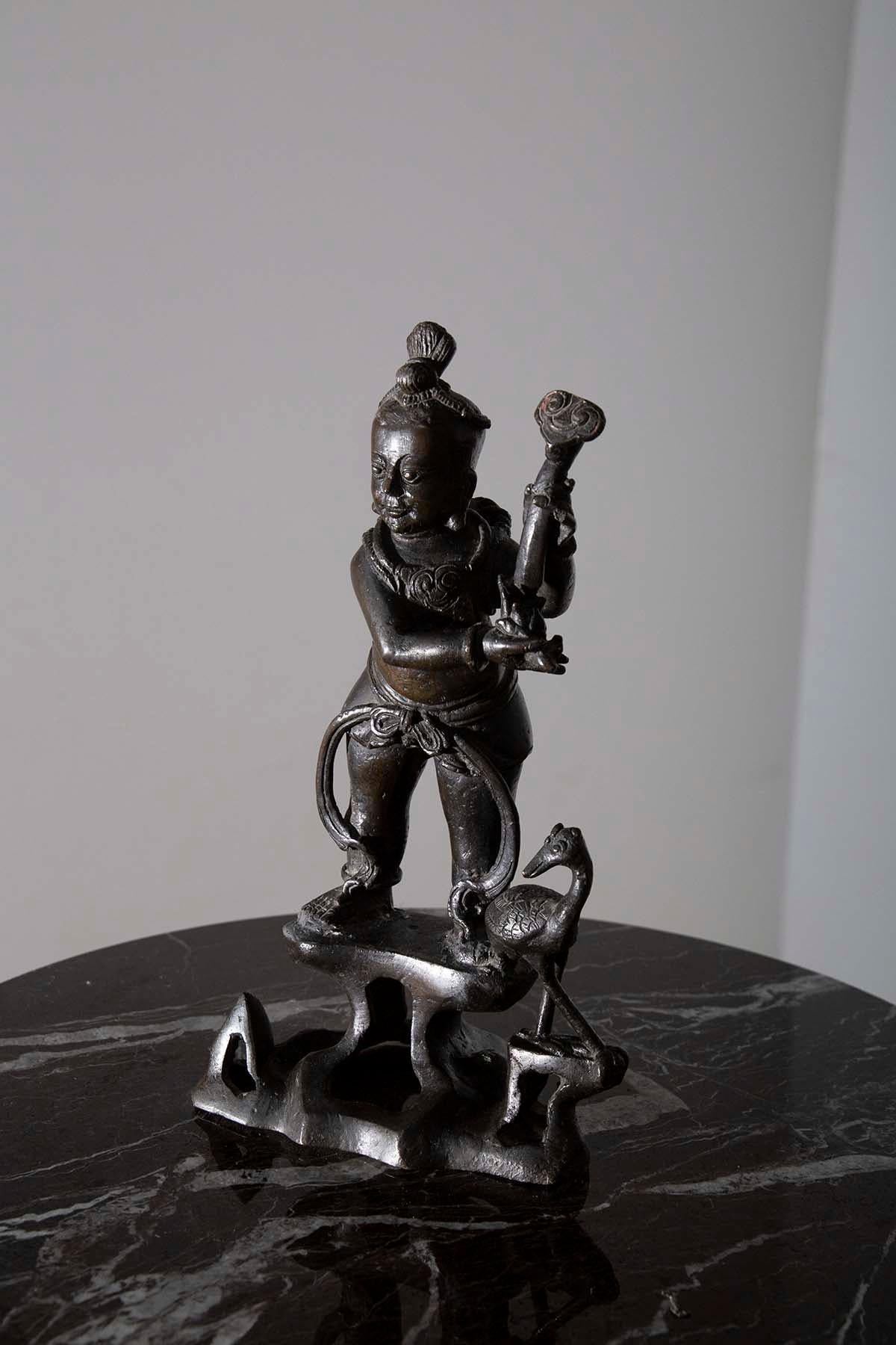 In the heart of ancient China, within the resplendent Ming dynasty, a masterpiece was cast in bronze, a testament to a culture steeped in mysticism and spirituality. This Taoist bronze figure, a relic from the 16th century, transcends mere
