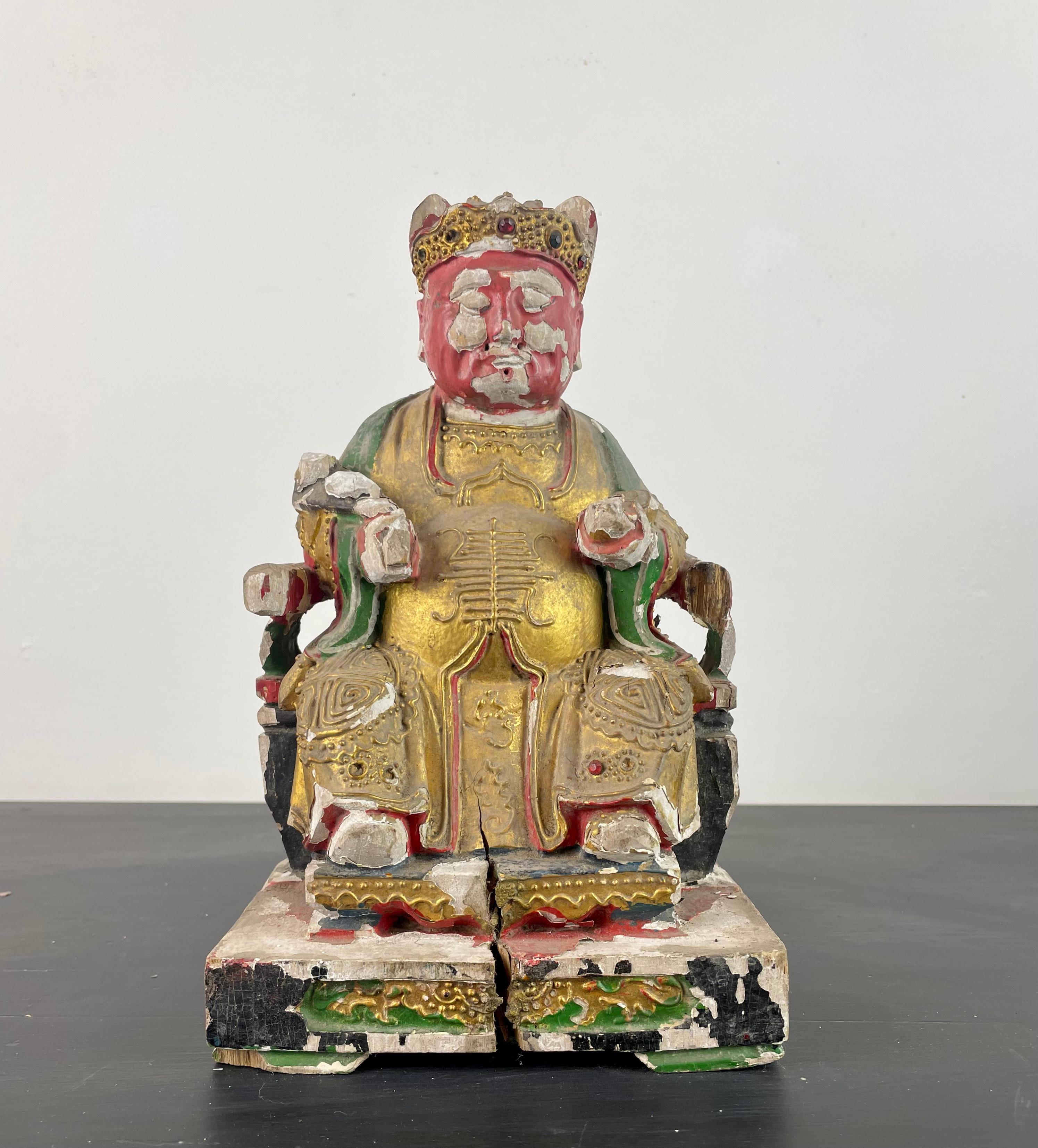 Very beautiful Taoist statue in polychrome and gold lacquered wood. It is carved from solid wood, with hand-painted details and embossed ornaments on the clothing.

This Statuette may represent a Taoist dignitary seated on his throne, who would wear