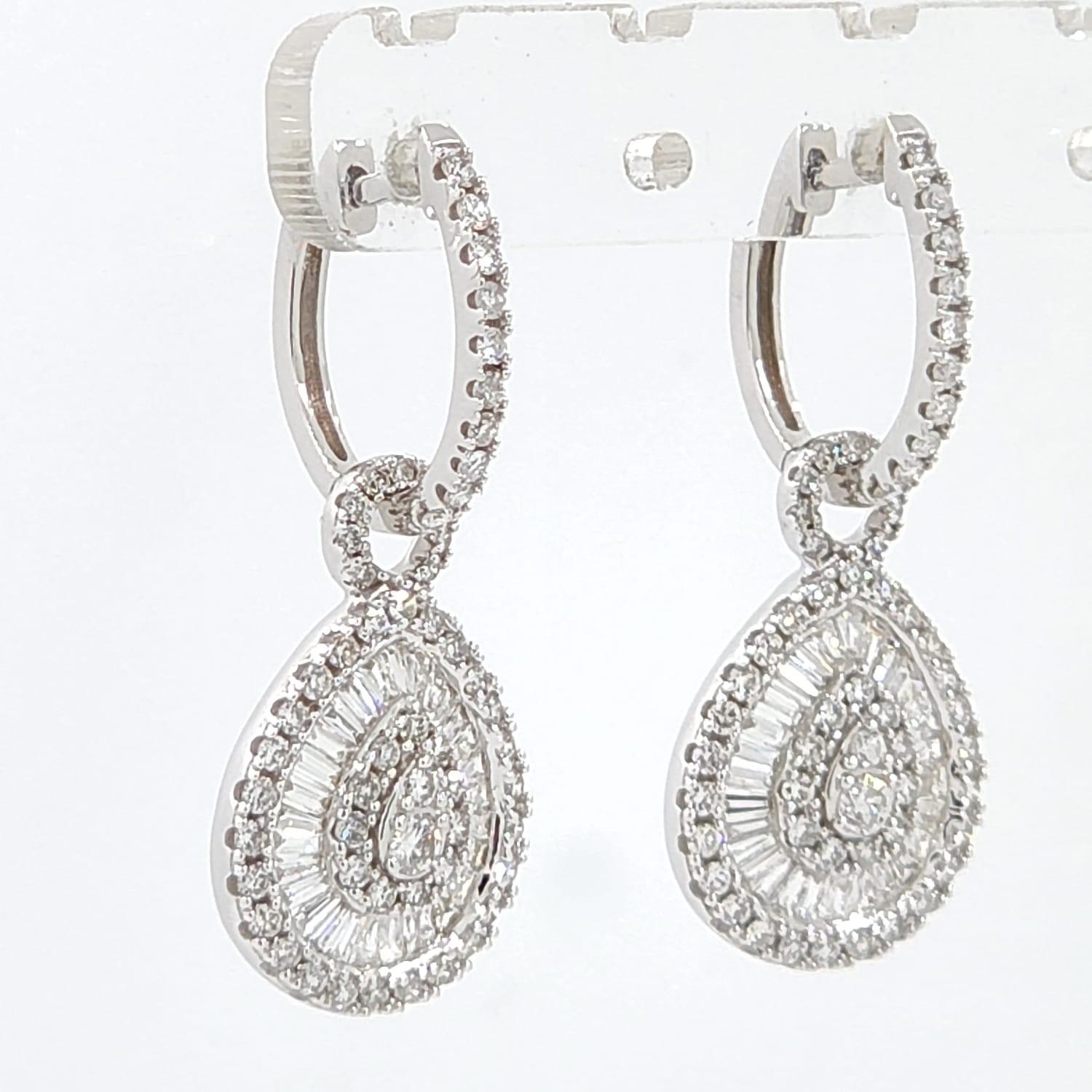 This earrings feature 0.53 carat of tapered diamonds and assented with 0.87 carat of round diamonds. Earrings are set in 14 karat white gold.

Taper Baguette Diamonds 0.53 carat
Round Diamonds 0.87 carat
14 Karat White Gold