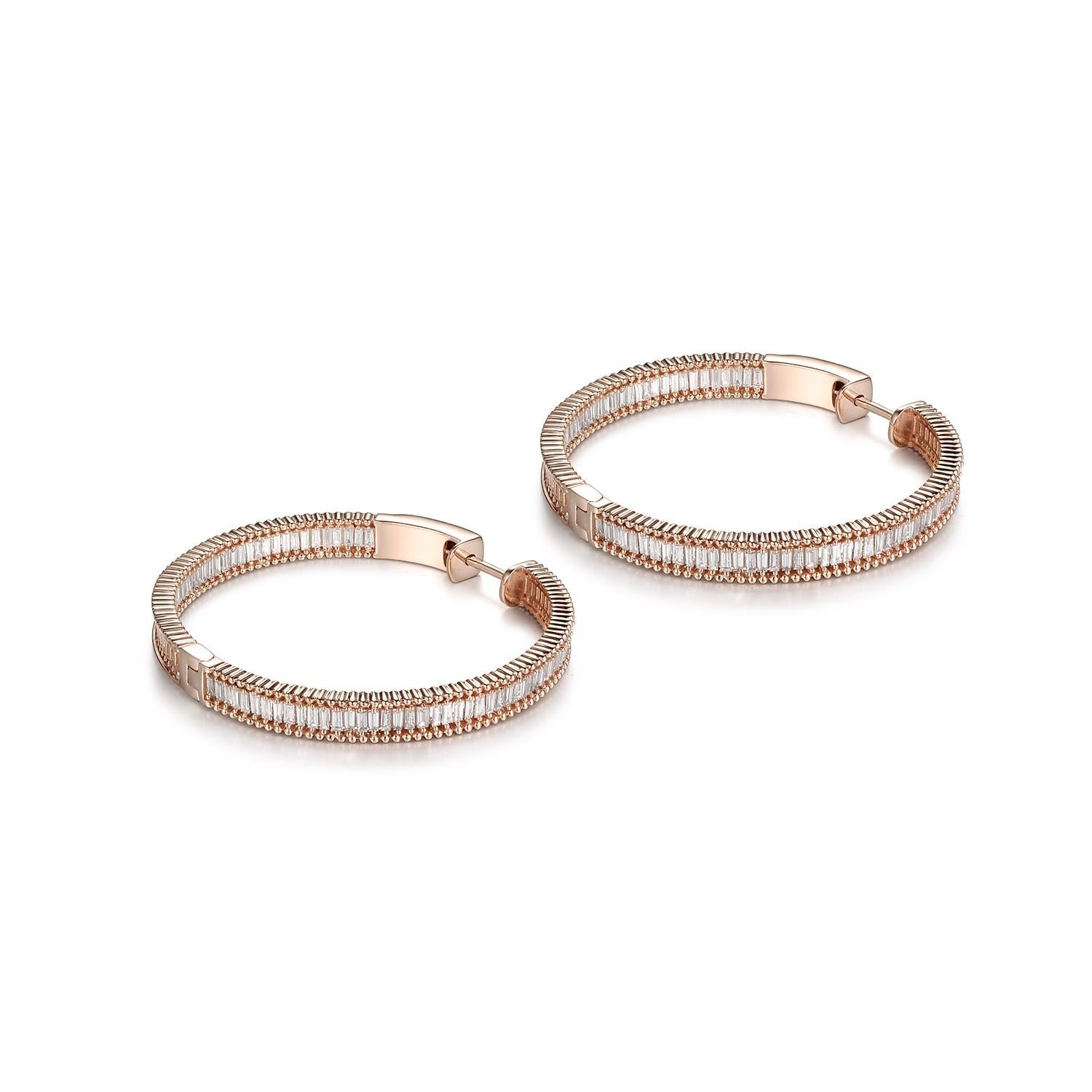 This hoop earrings feature 1.43 carat of taper diamonds. Earrings are set in 18 karat rose gold. The back of the earrings use a push clasp setting to ensure the safety of the earrings. 
Diameter 25.46 mm
Width 4.13 mm
Taper Diamonds 1.43 carat 
18