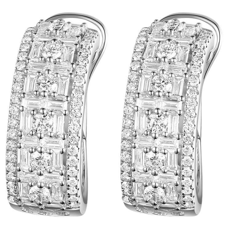 This hoop earrings feature 0.94 carat of taper diamonds, assented with 0.80 carats of round diamonds on the side.  Earrings are set in 18 karat white gold.

18 Karat White Gold
Taper Diamonds 0.94 carat 
Round Diamonds 0.80 carat
