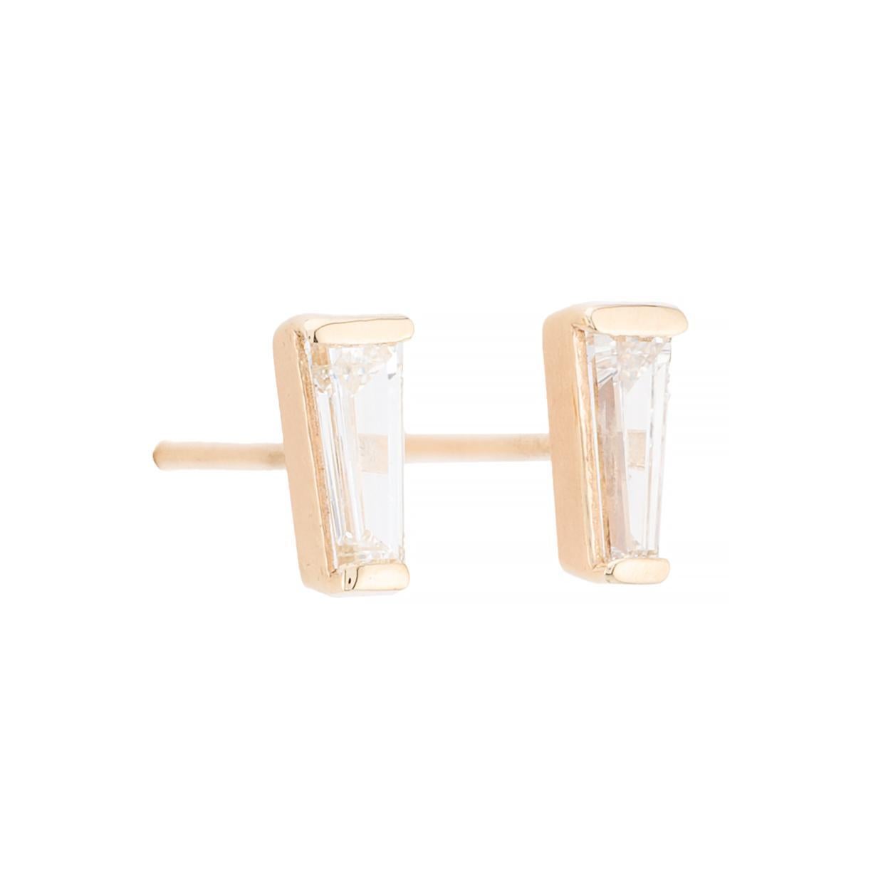 Aston Estate Jewelry Presents:

Contemporary stud earrings crafted in 14k yellow gold. Each earring features a tapered baguette-cut diamond, showcasing a clarity of VS1 and a color grade of G. The sleek design highlights the diamond's elegance. 