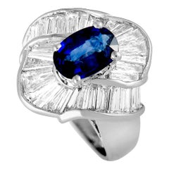 Tapered Baguette Diamonds and Sapphire Platinum Oval Ring