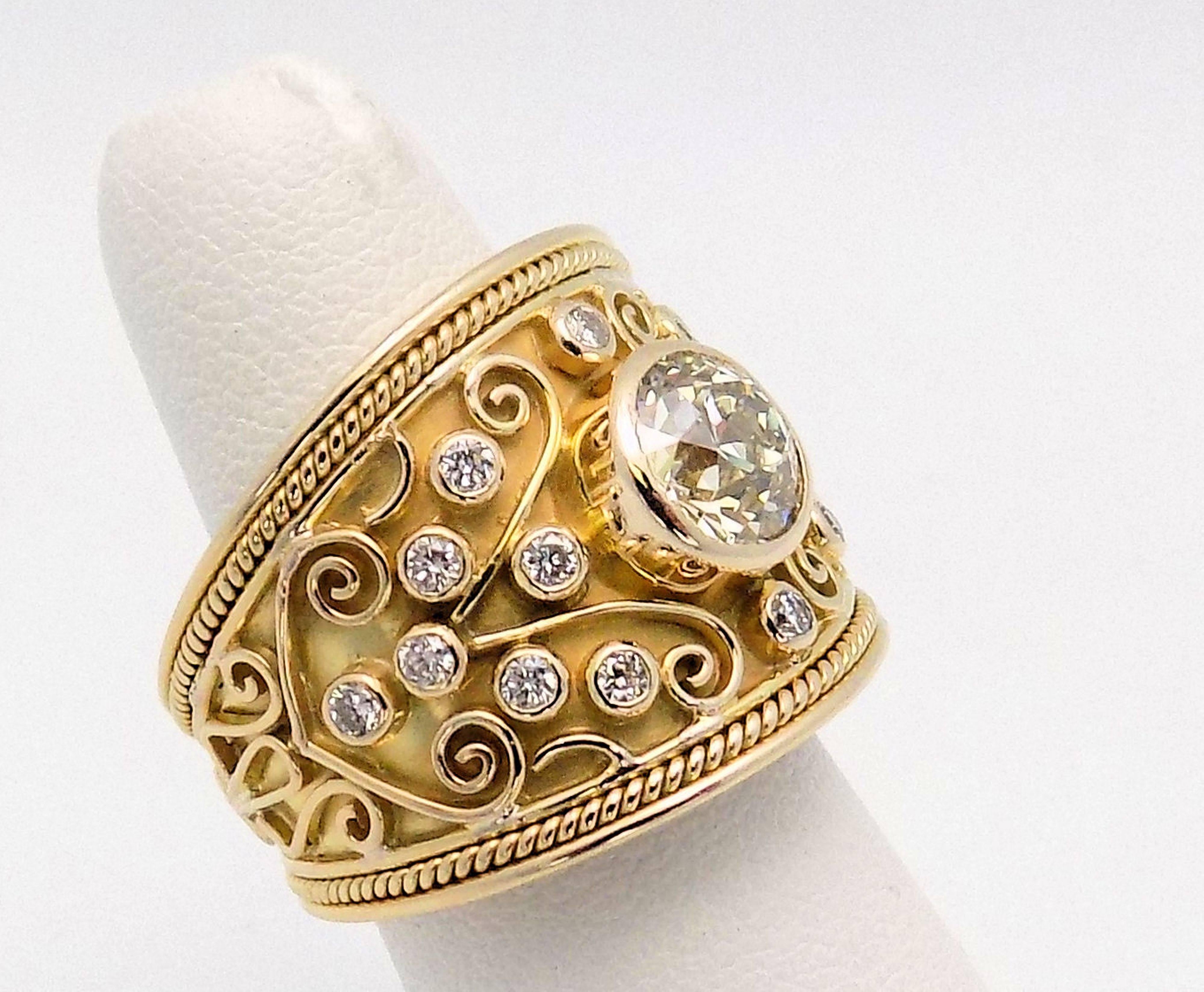14 Karat Yellow Gold Tapered Band 1 European Cut Diamond Approximately 2.00 Carat VS-2, K-L, 14 Round Brilliant Diamonds 0.48 Carat Total Weight SI, H-I. Finger Size 9; 12.2 DWT or 18.97 Grams.