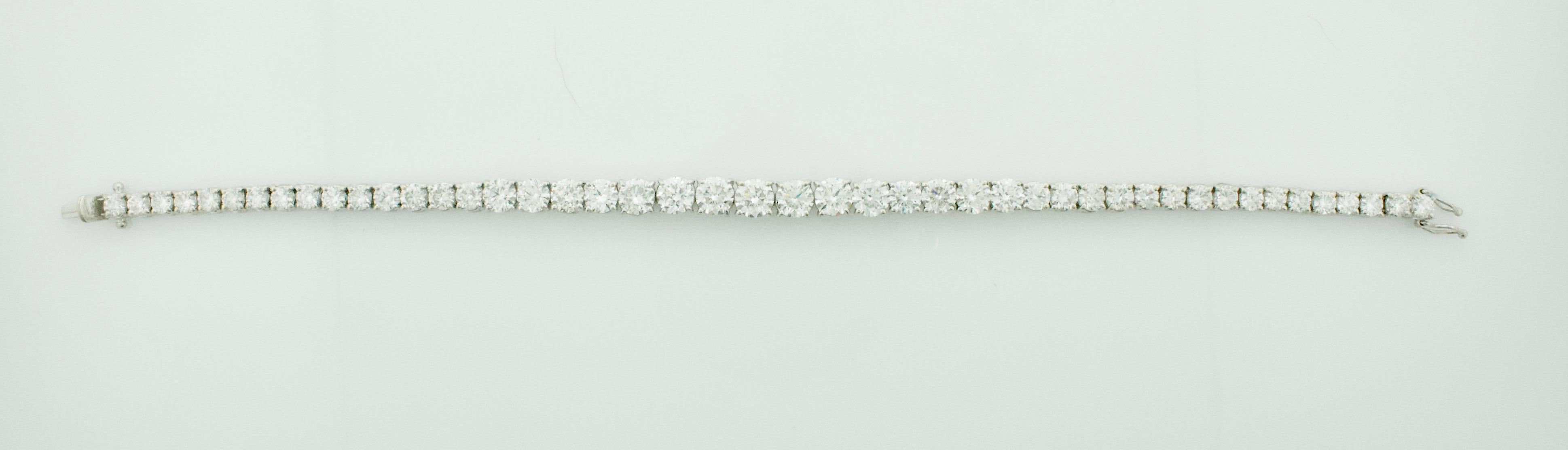 Tapered Diamond Tennis Bracelet in 18k White Gold 9.75 Carats
Purchased in Dubai in Early 2000's 
47 Round Brilliant Cut Diamonds Weighing 9.75 Carats Approximately [Color GH Clarity VVS - SI]
7 Round Brilliant Cut Diamonds Weighing 3.10 Carats