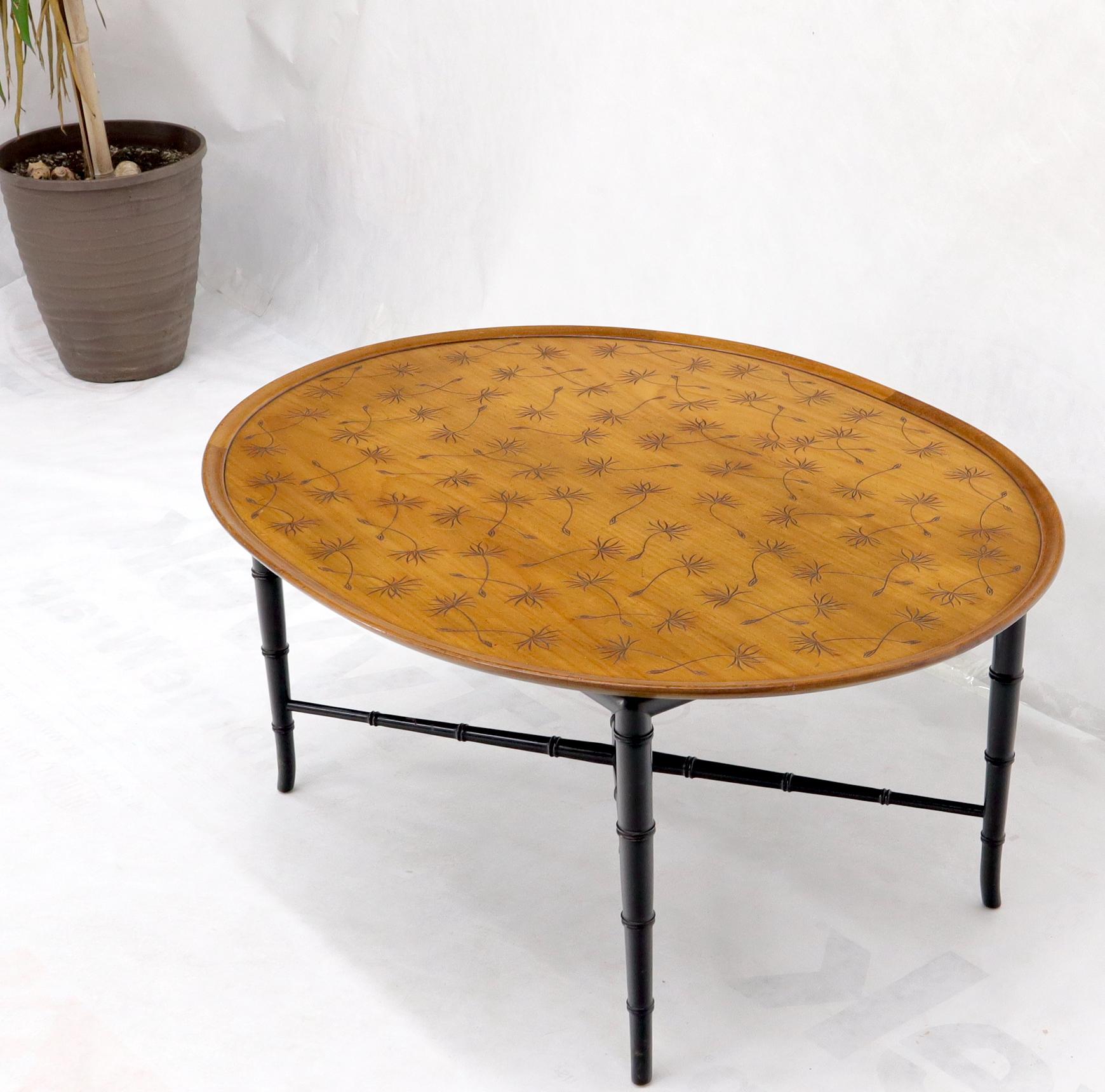 Mid-Century Modern decorative tapered faux bamboo coffee table. Carved in leaf top design.