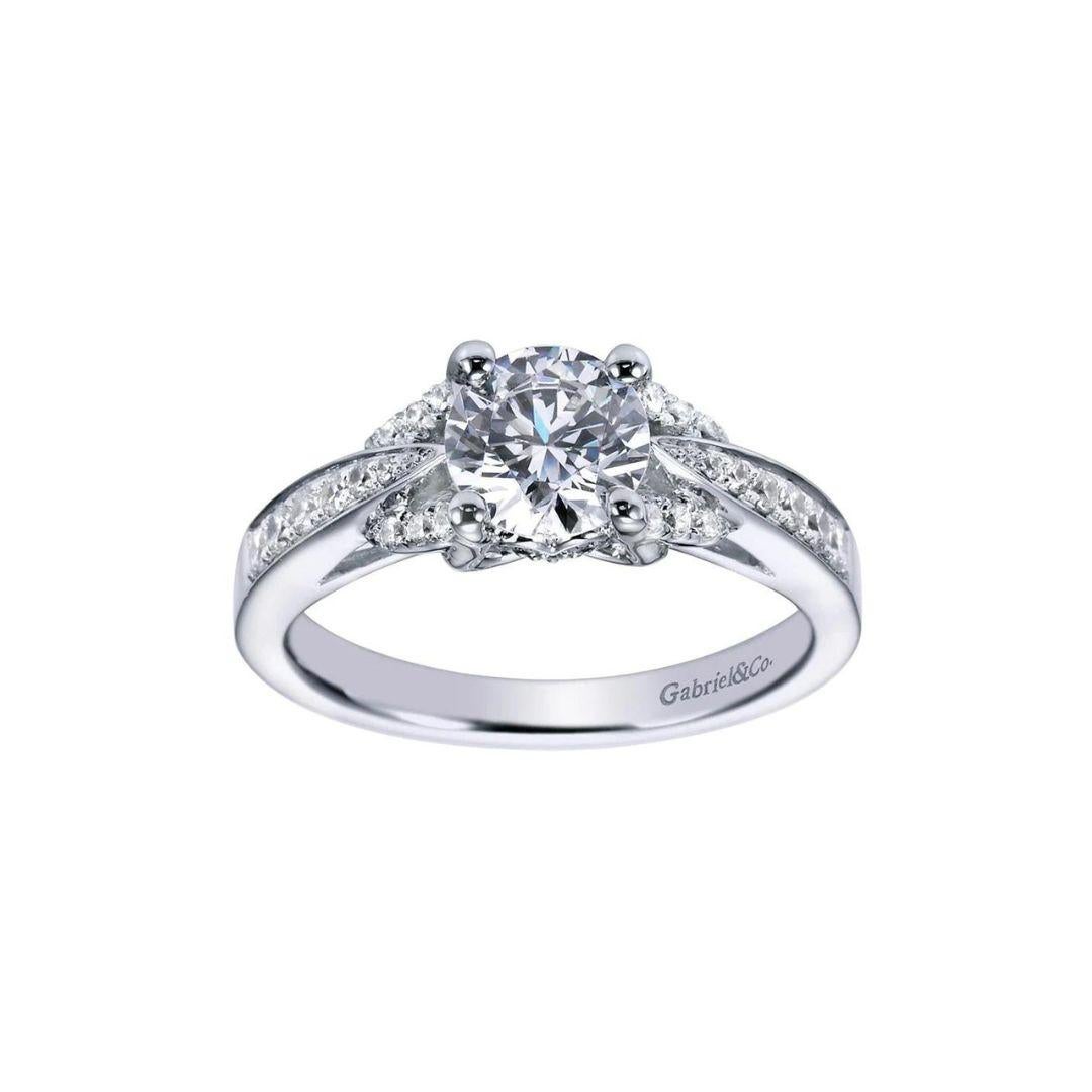 Tapered Pave Design Diamond Engagement Mounting in 14k White Gold. Center diamond NOT included. Side diamonds weigh a total carat weight of 0.30 ctw, H color, SI clarity.